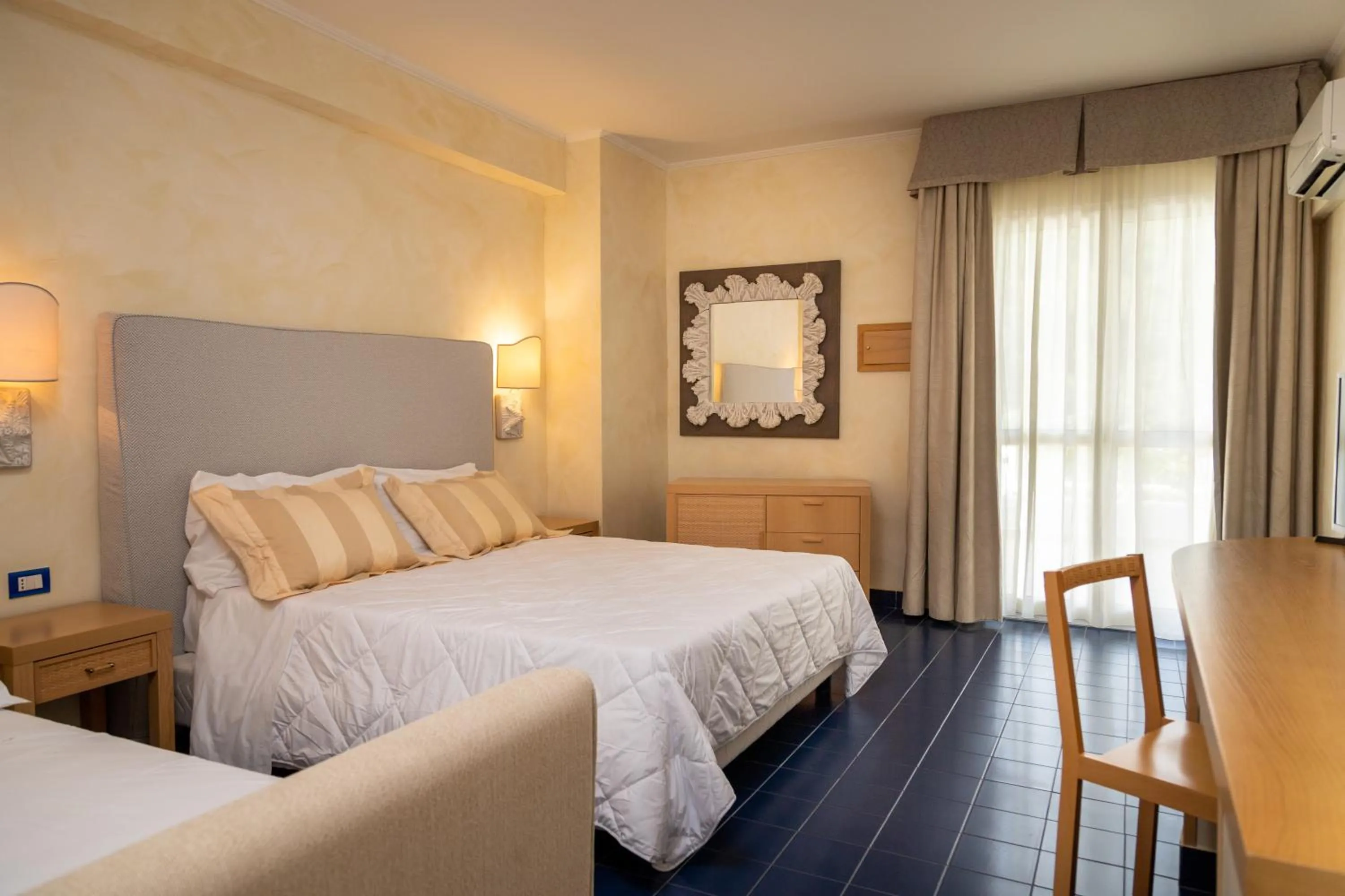 Bed in AH Premium Baia dei Faraglioni