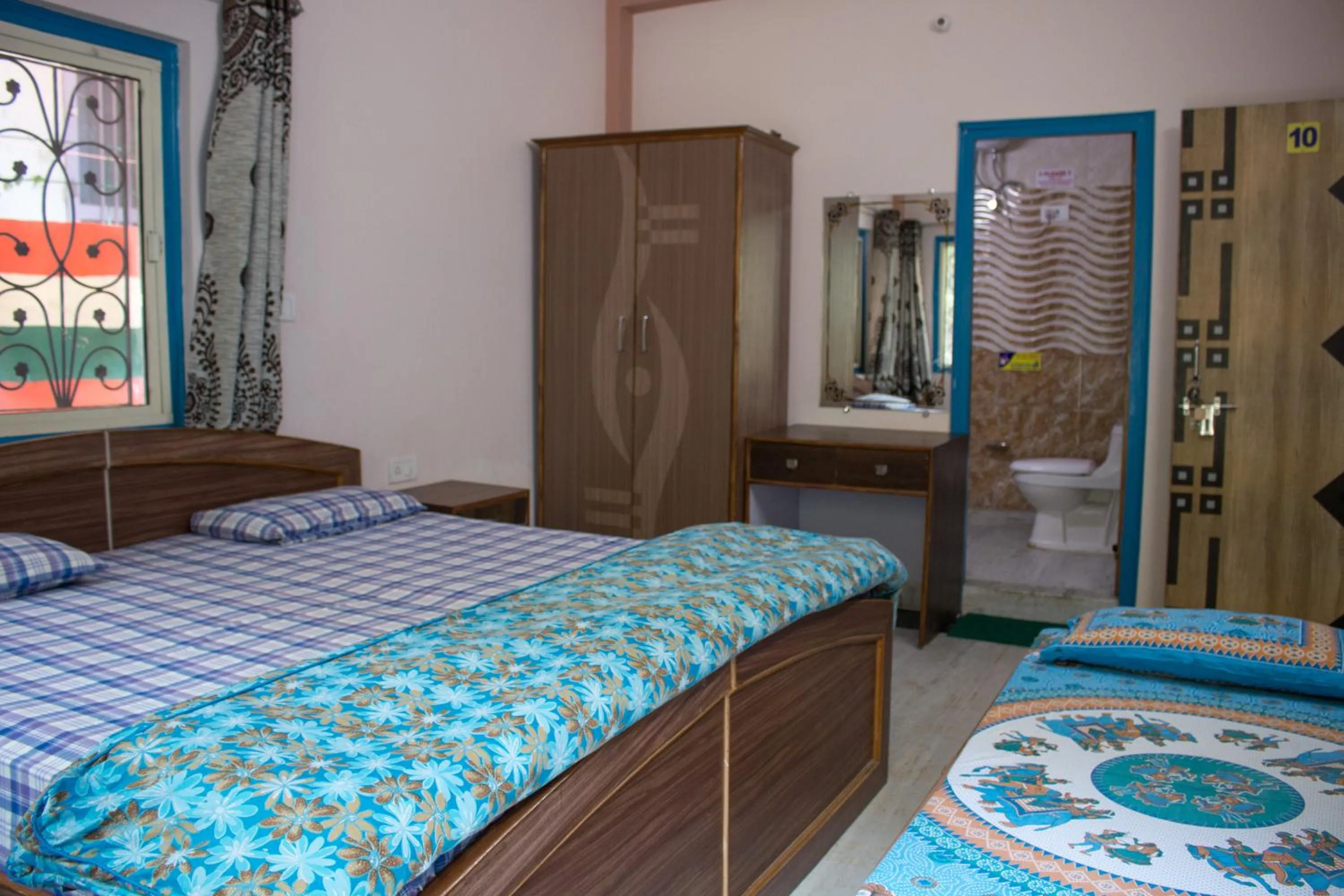 Photo of the whole room in Hotel Golden Crown Laxman Jhula