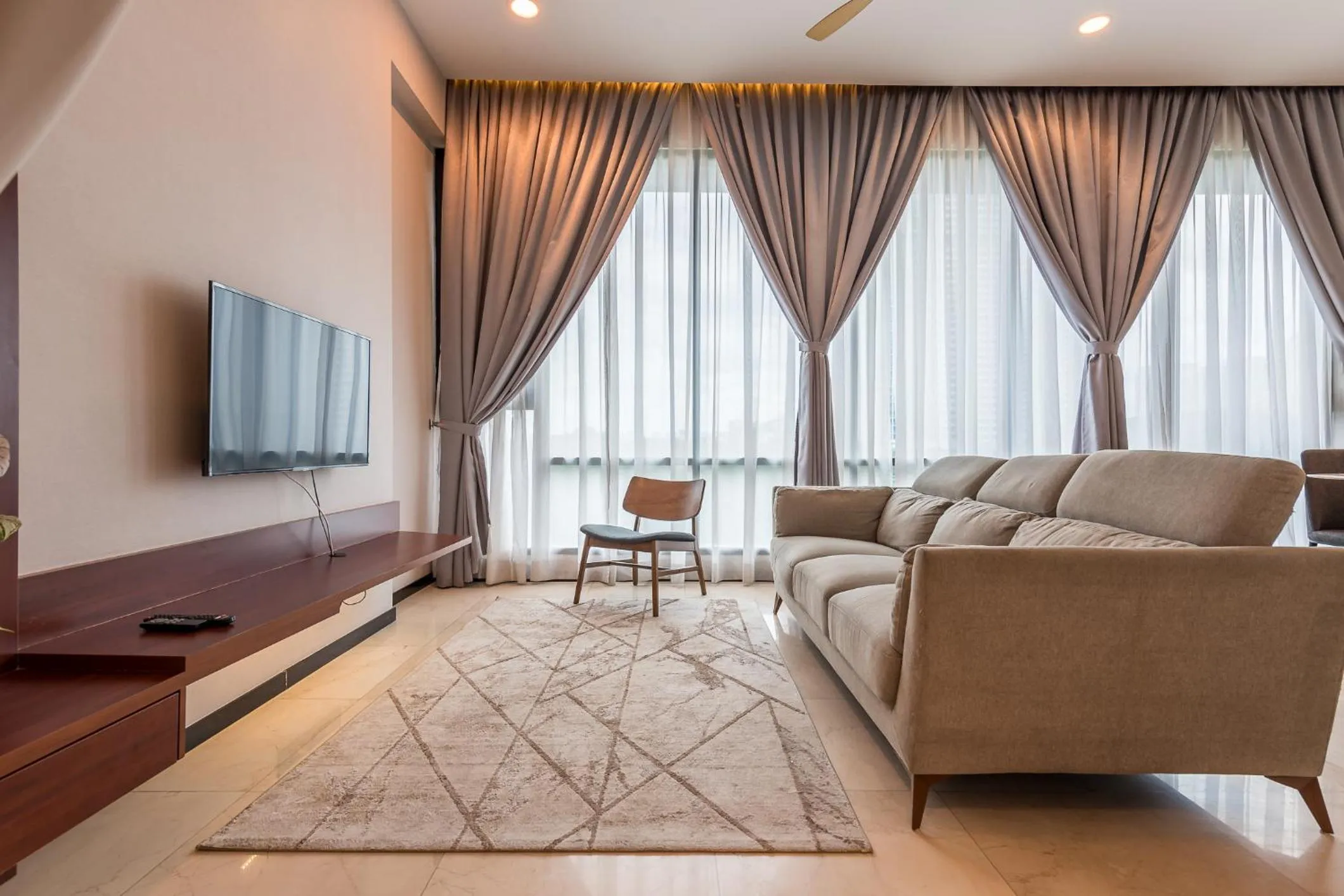 Living room in Opus Residences by Centurypro