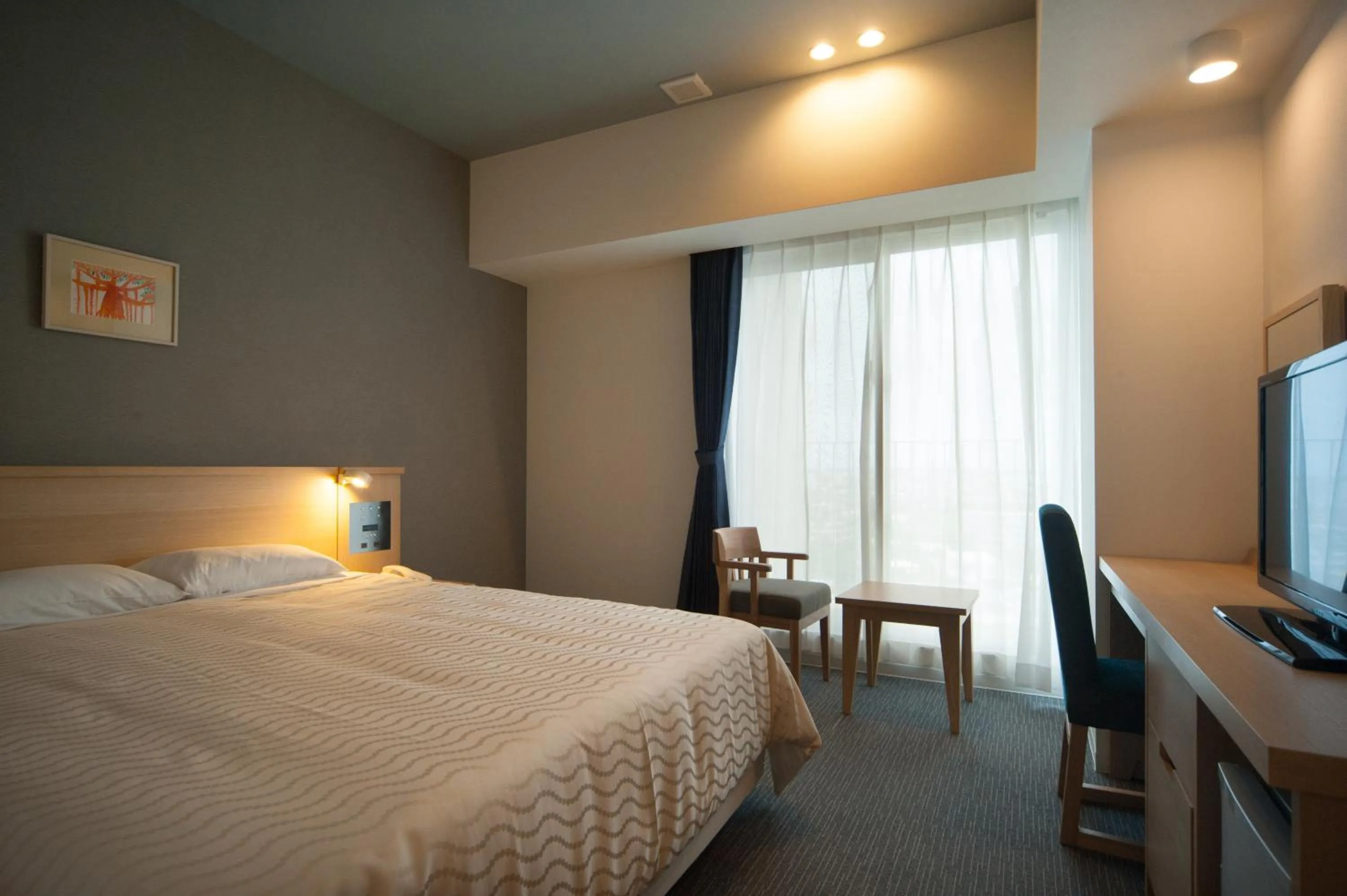 Photo of the whole room, Bed in Hotel Risingsun Miyakojima