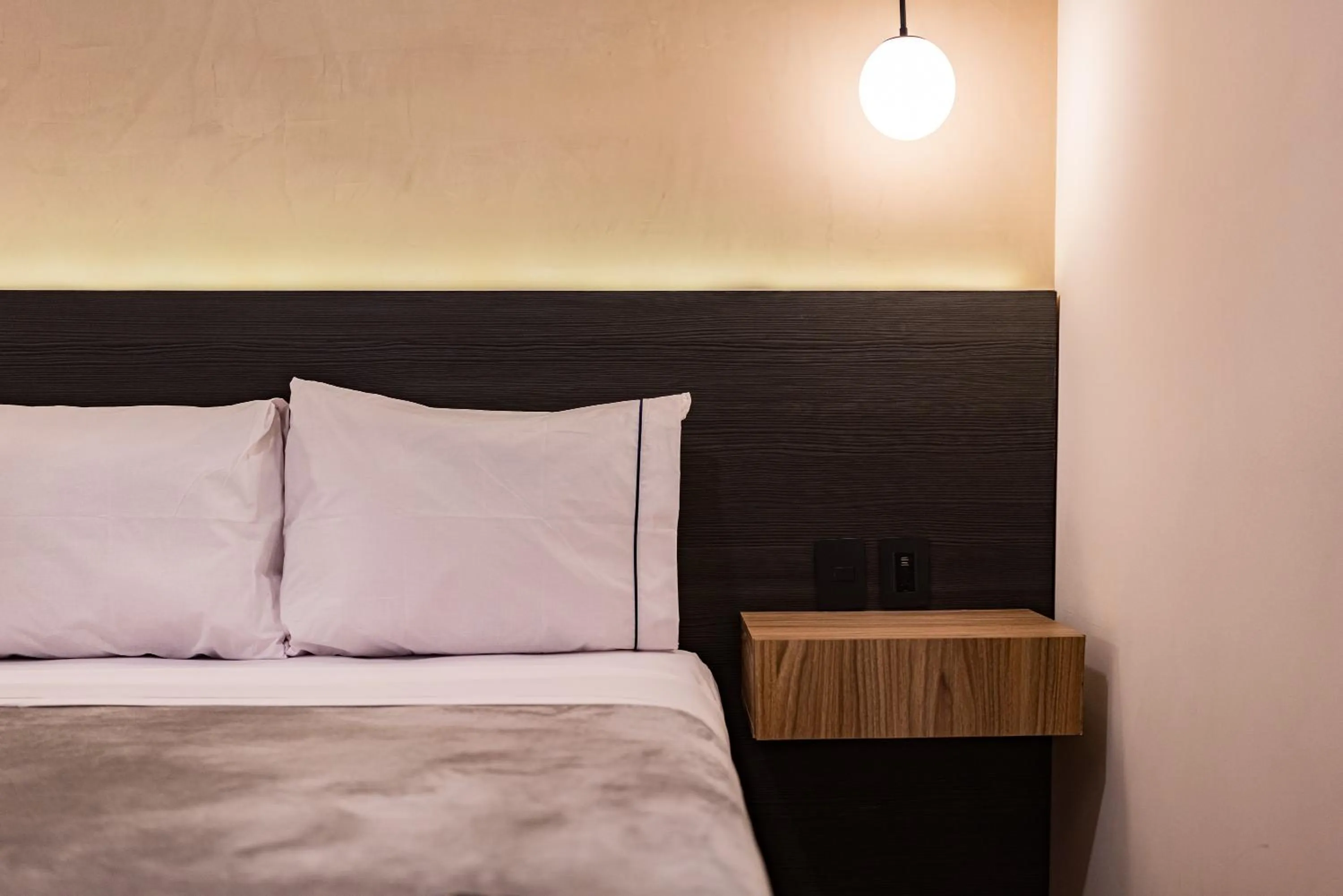 Bed in Suites Monterrey by Escajal Rooms