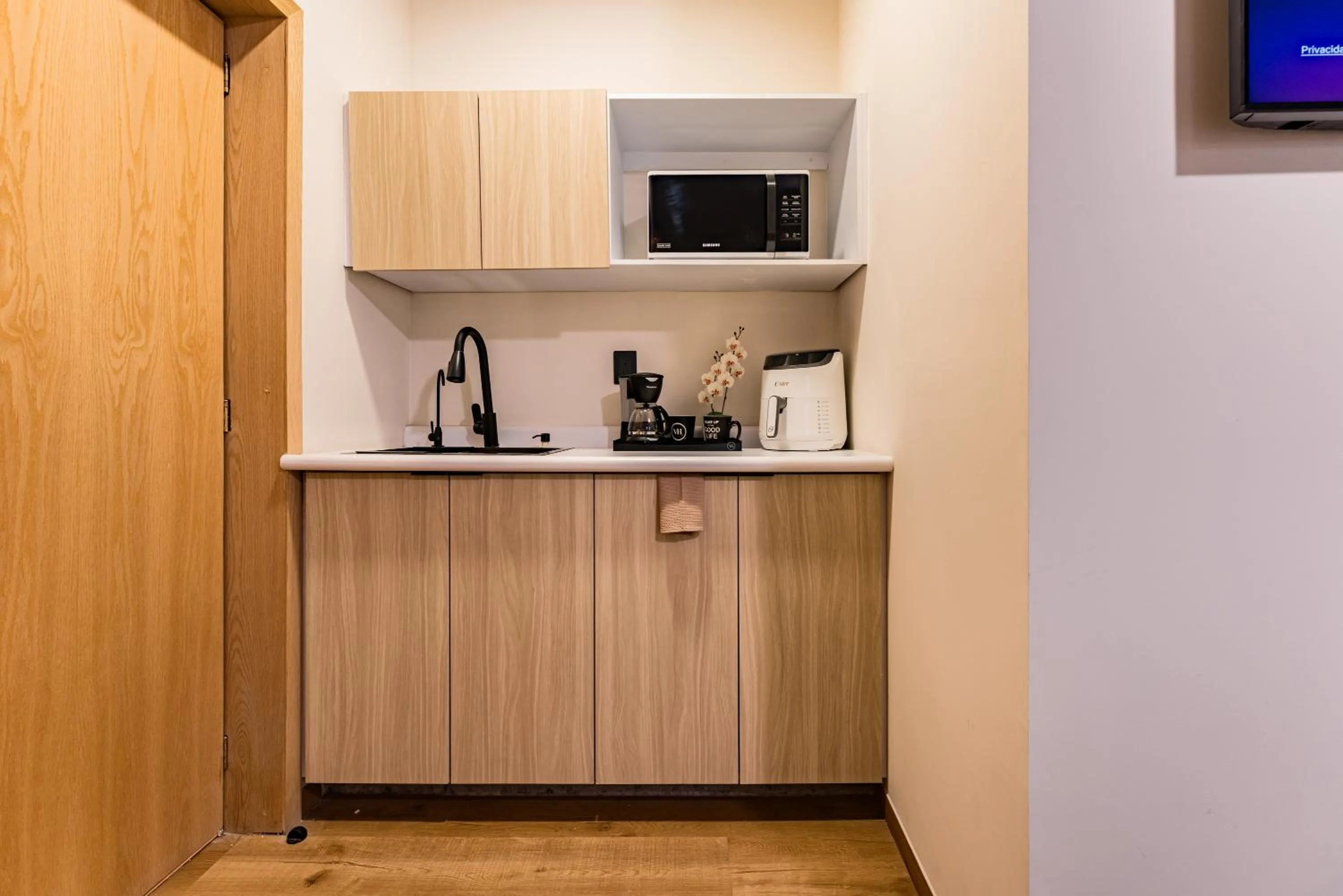 Kitchen or kitchenette in Suites Monterrey by Escajal Rooms