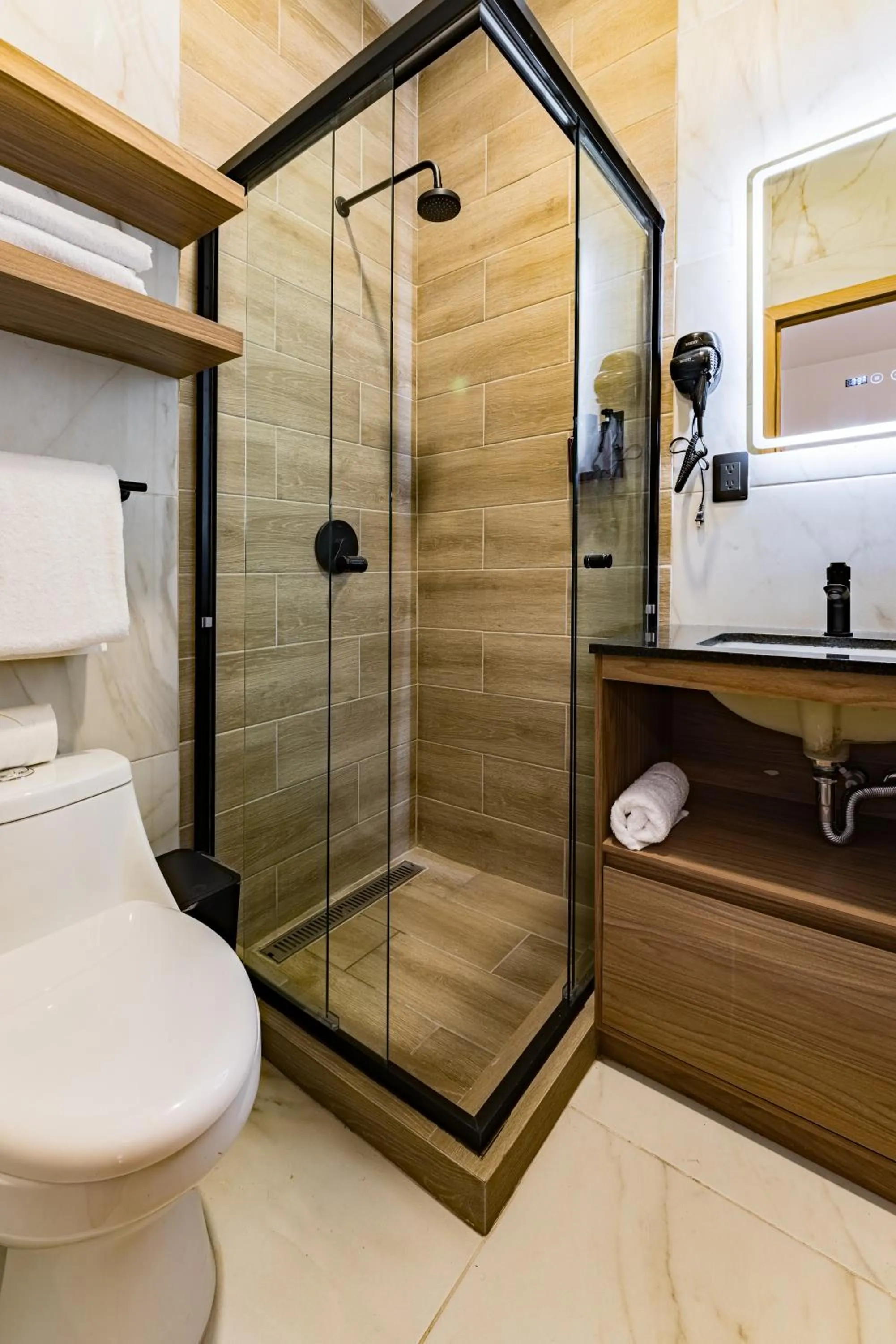 Shower in Suites Monterrey by Escajal Rooms