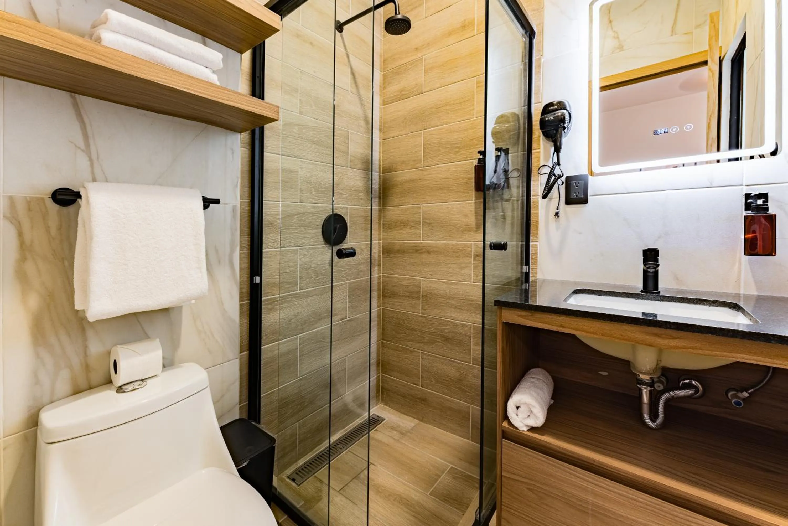 Shower in Suites Monterrey by Escajal Rooms