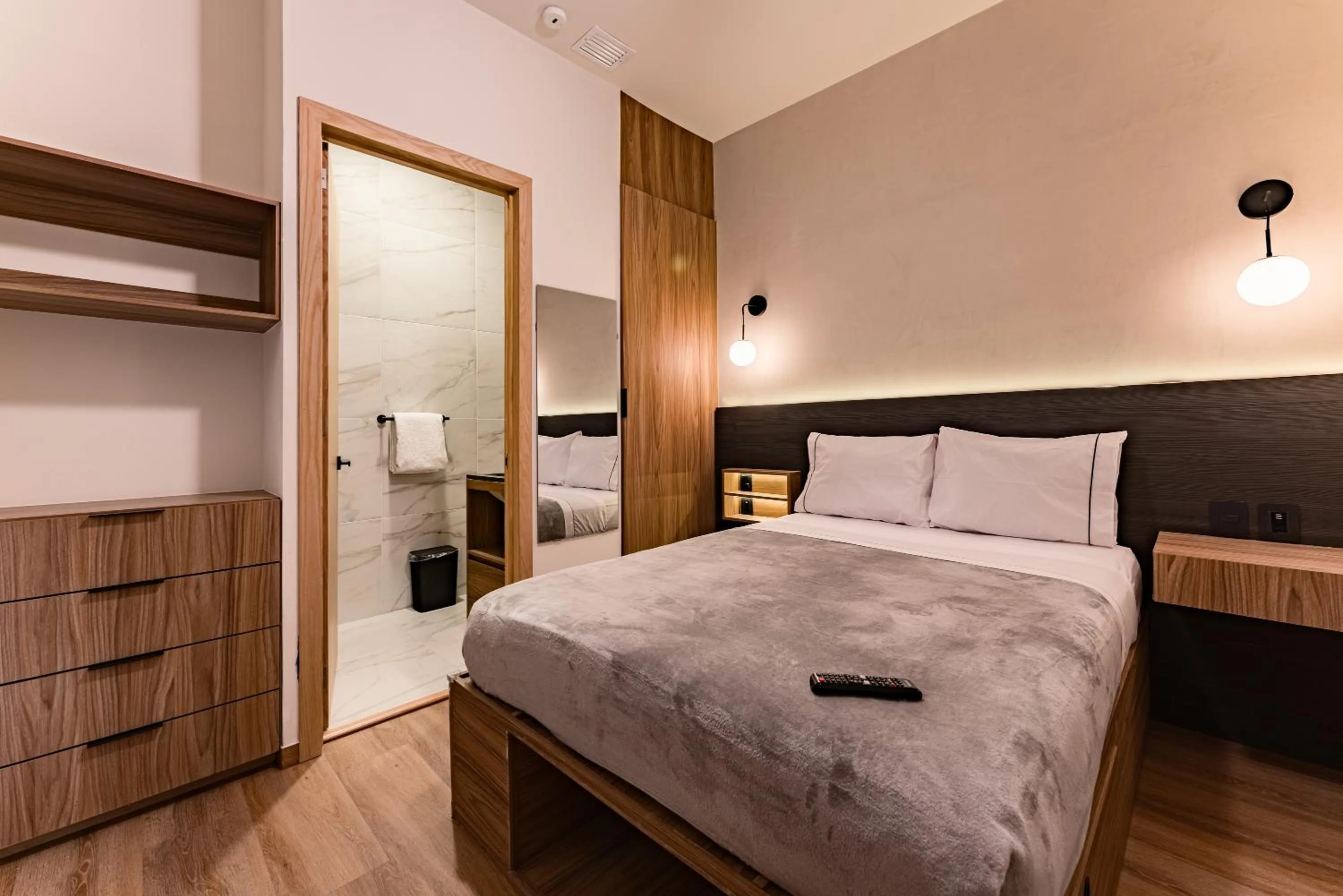 Bed in Suites Monterrey by Escajal Rooms