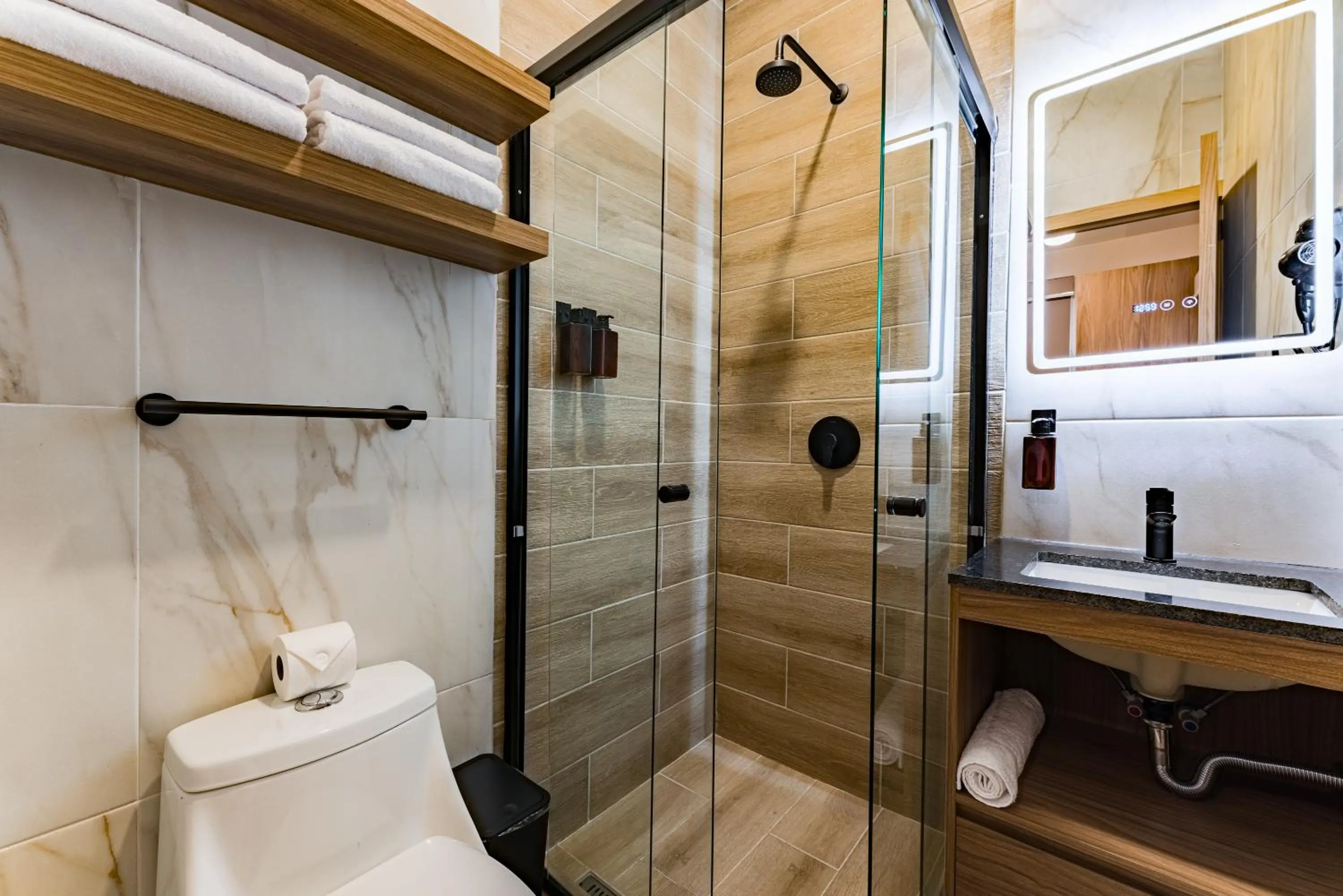 Shower in Suites Monterrey by Escajal Rooms