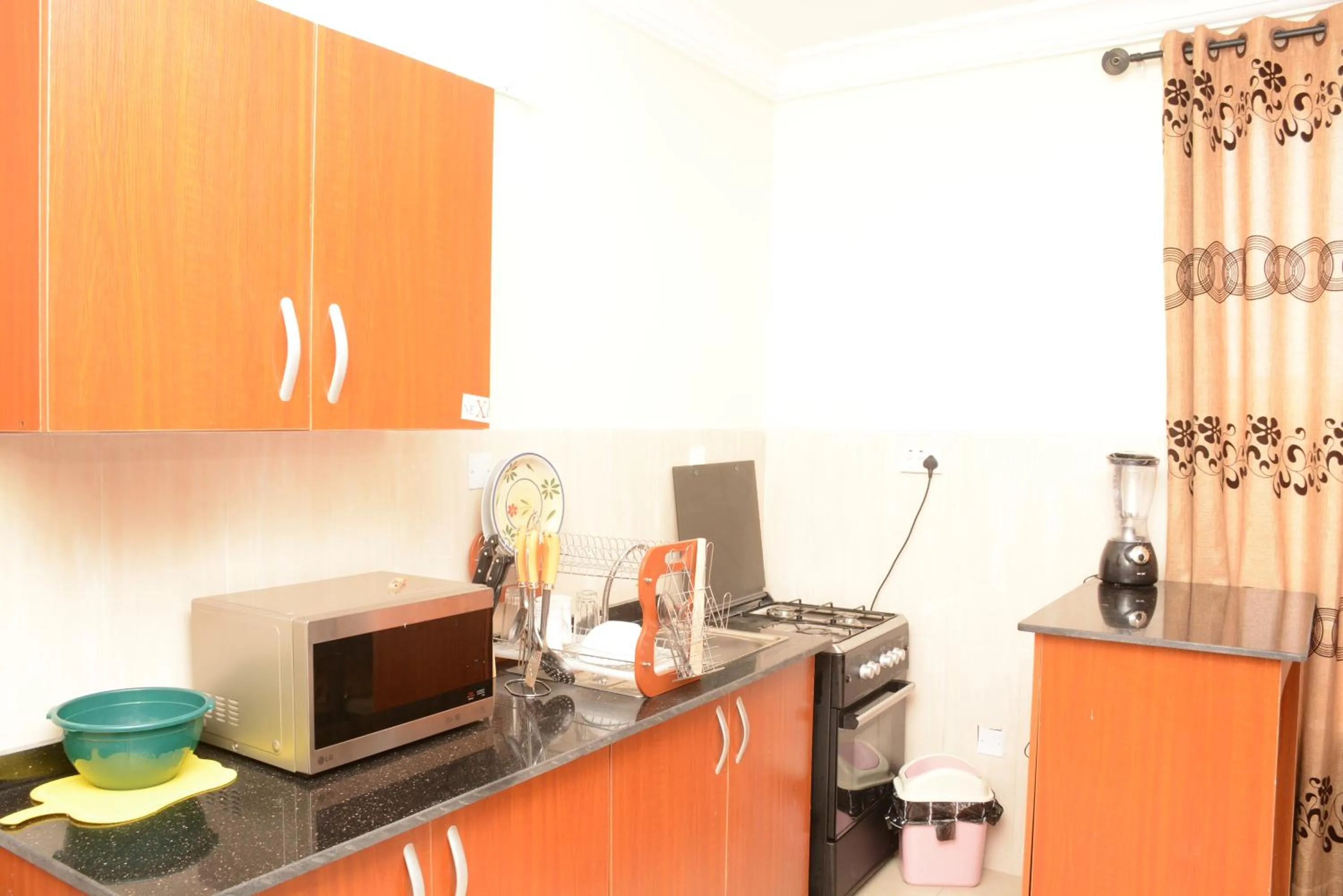 Kitchen or kitchenette in VTL Suites