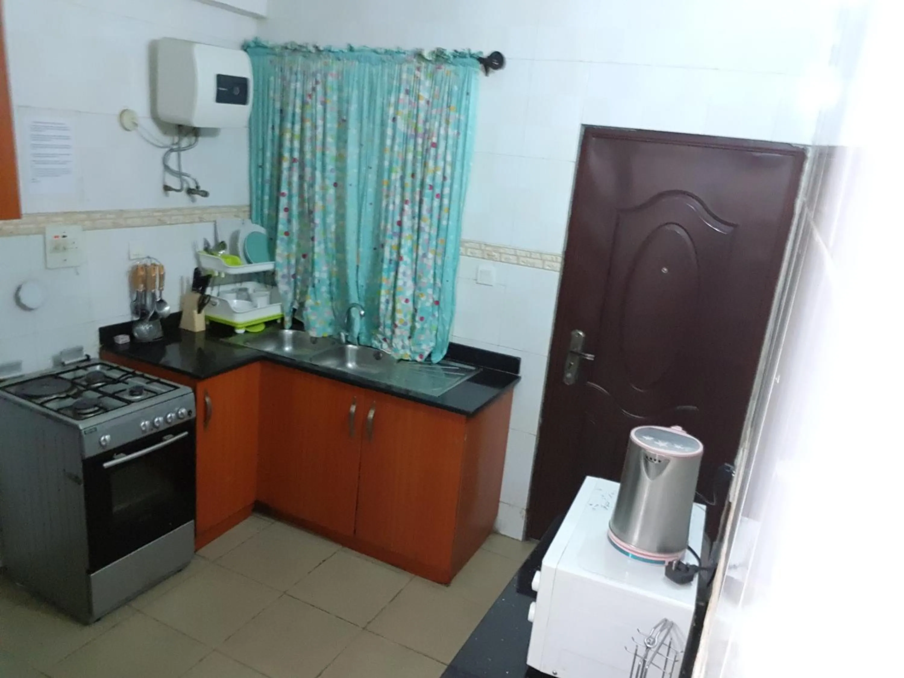 Kitchen or kitchenette in VTL Suites