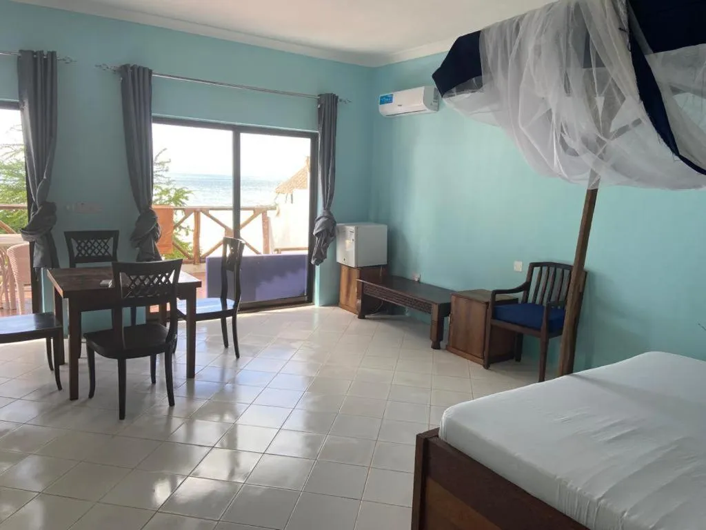 Seating area, Bed in Kaure Sand Beach Lodge