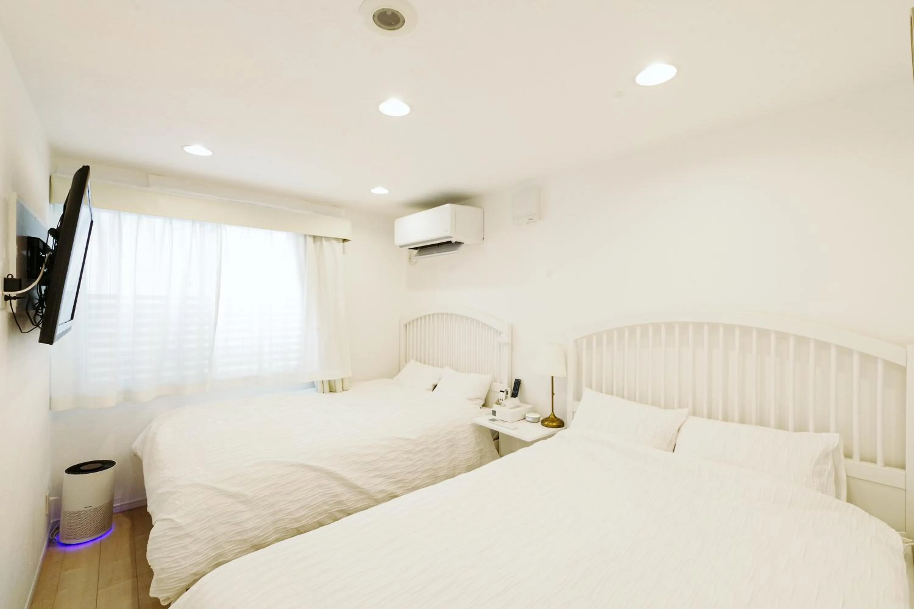 Bed in Oceanfront Villa Hale Kahakai プライベートサウナ