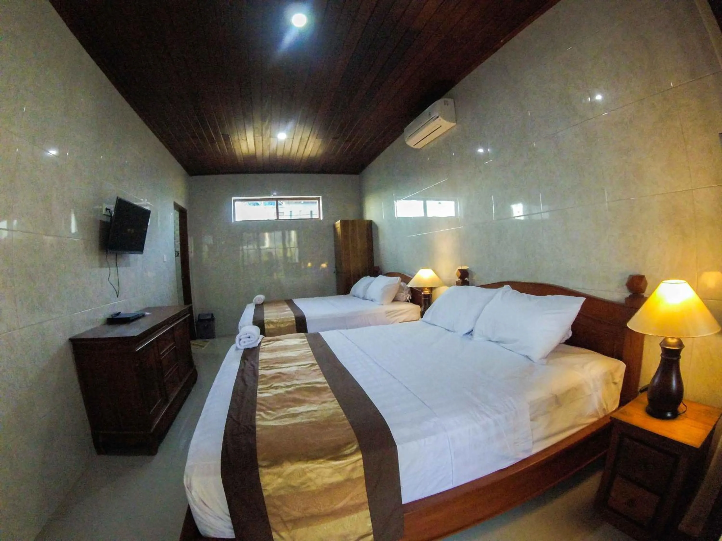 Bed in Adi Homestay