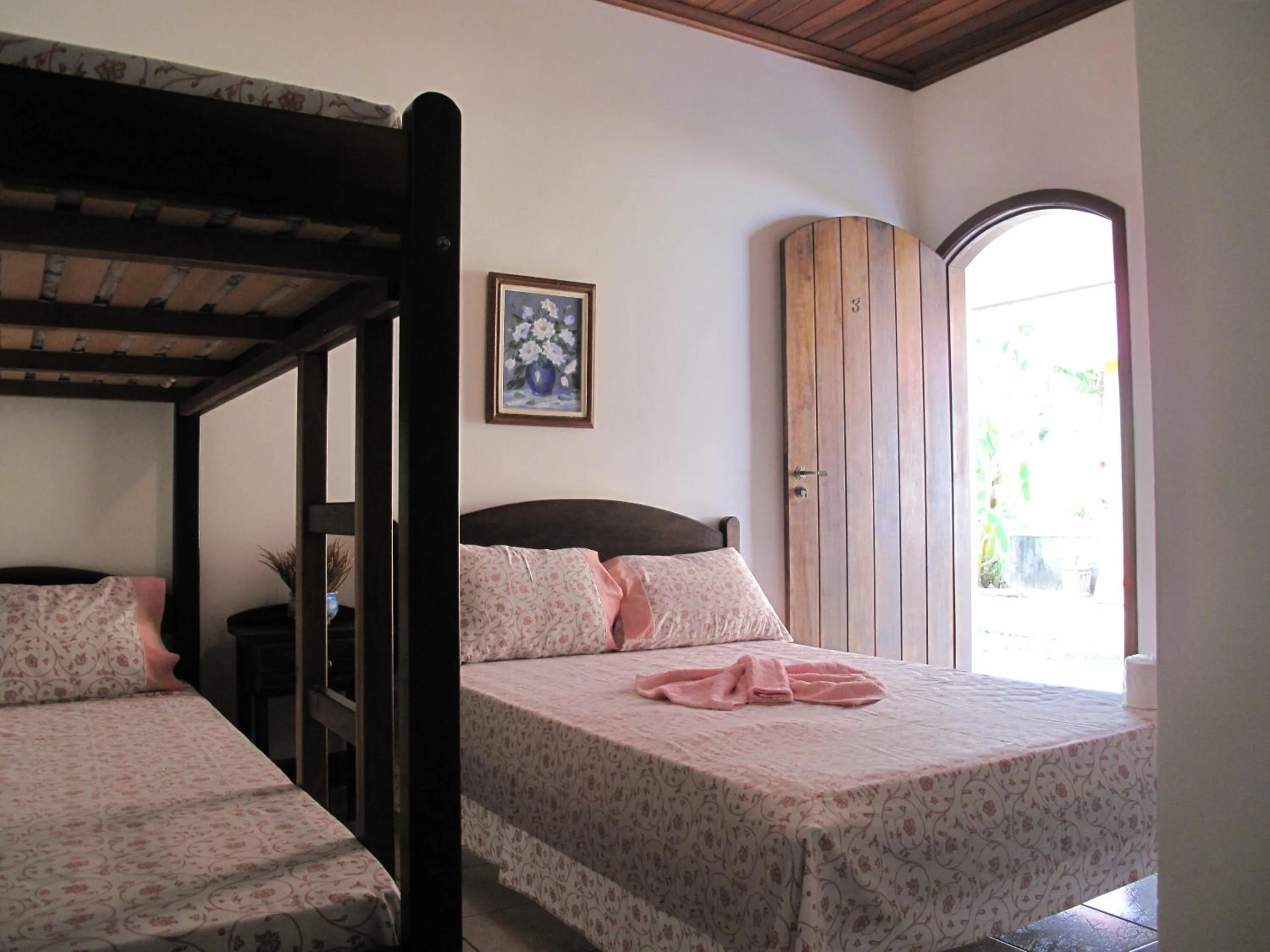 Bed in Pousada Atelier Aly da Costa