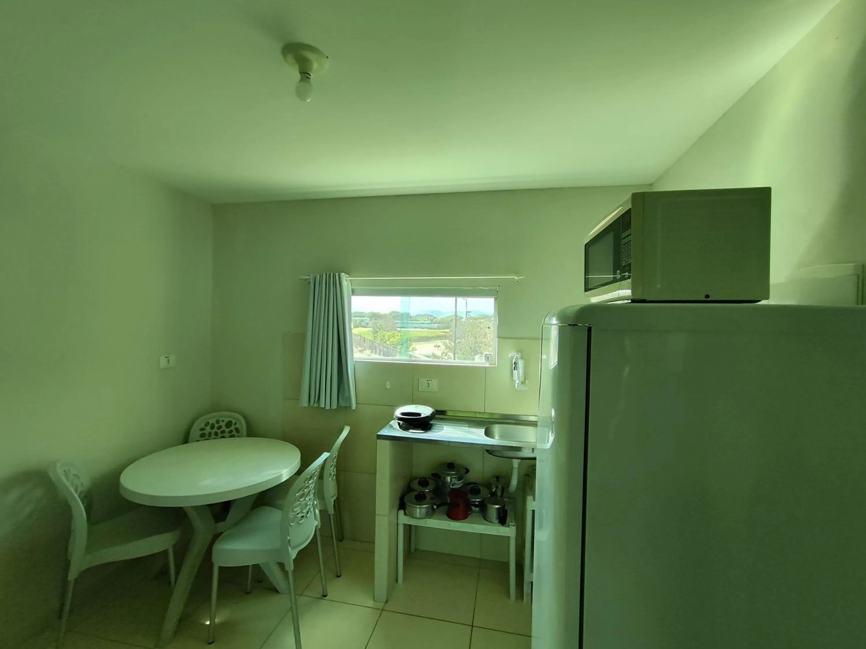 Kitchen or kitchenette in Divinos Flat Carneiros
