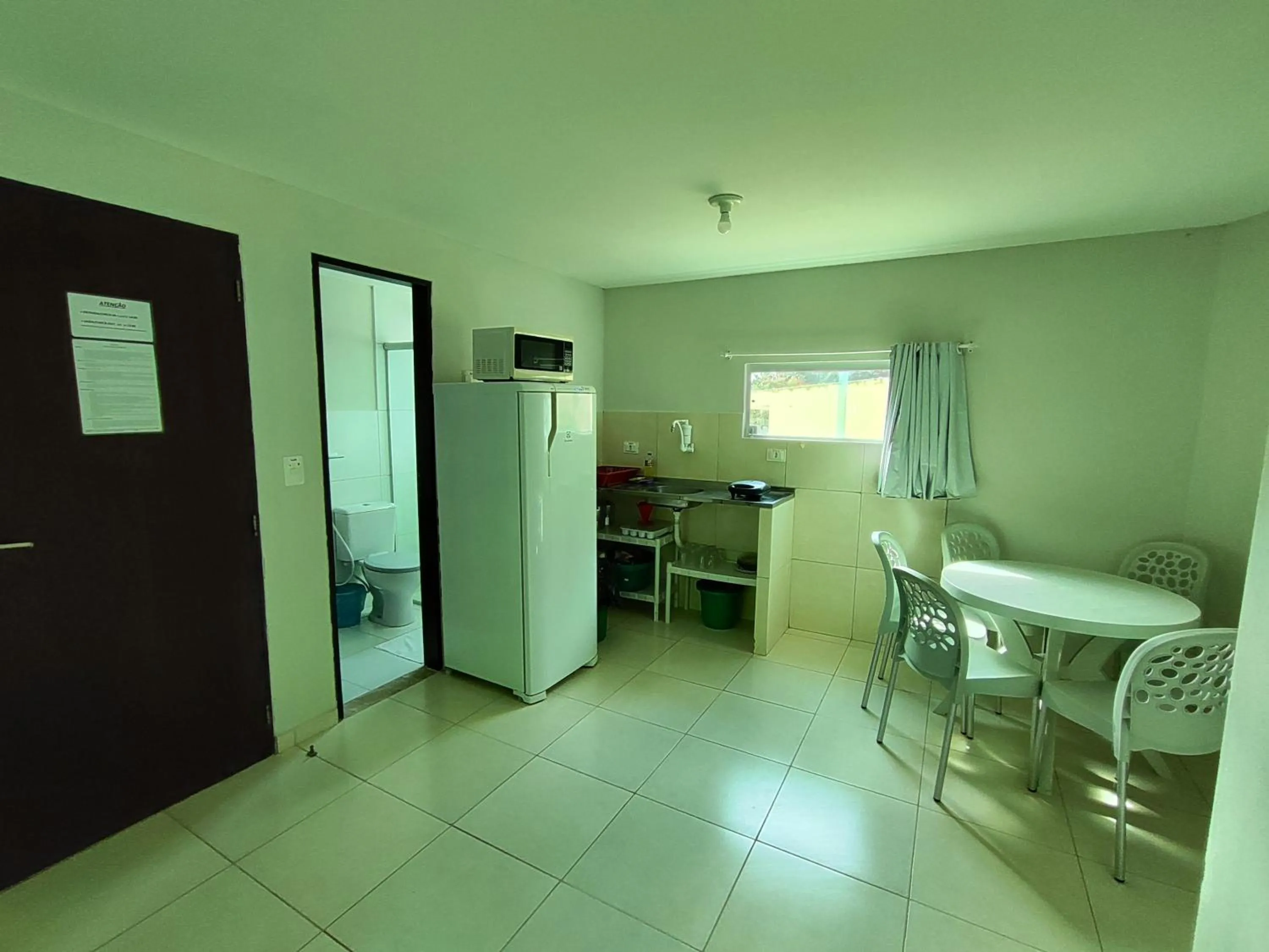Kitchen or kitchenette in Divinos Flat Carneiros