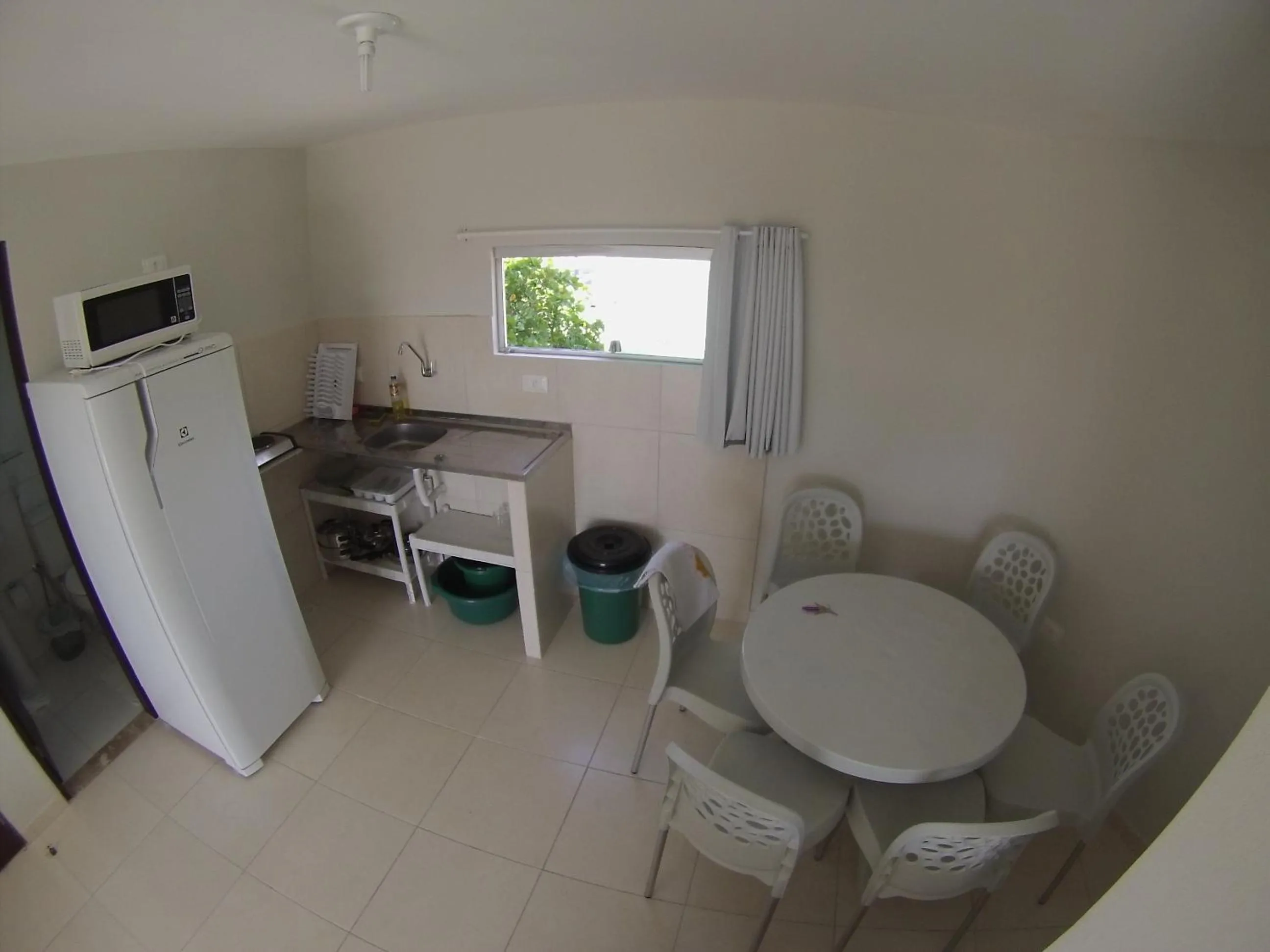 Kitchen or kitchenette in Divinos Flat Carneiros