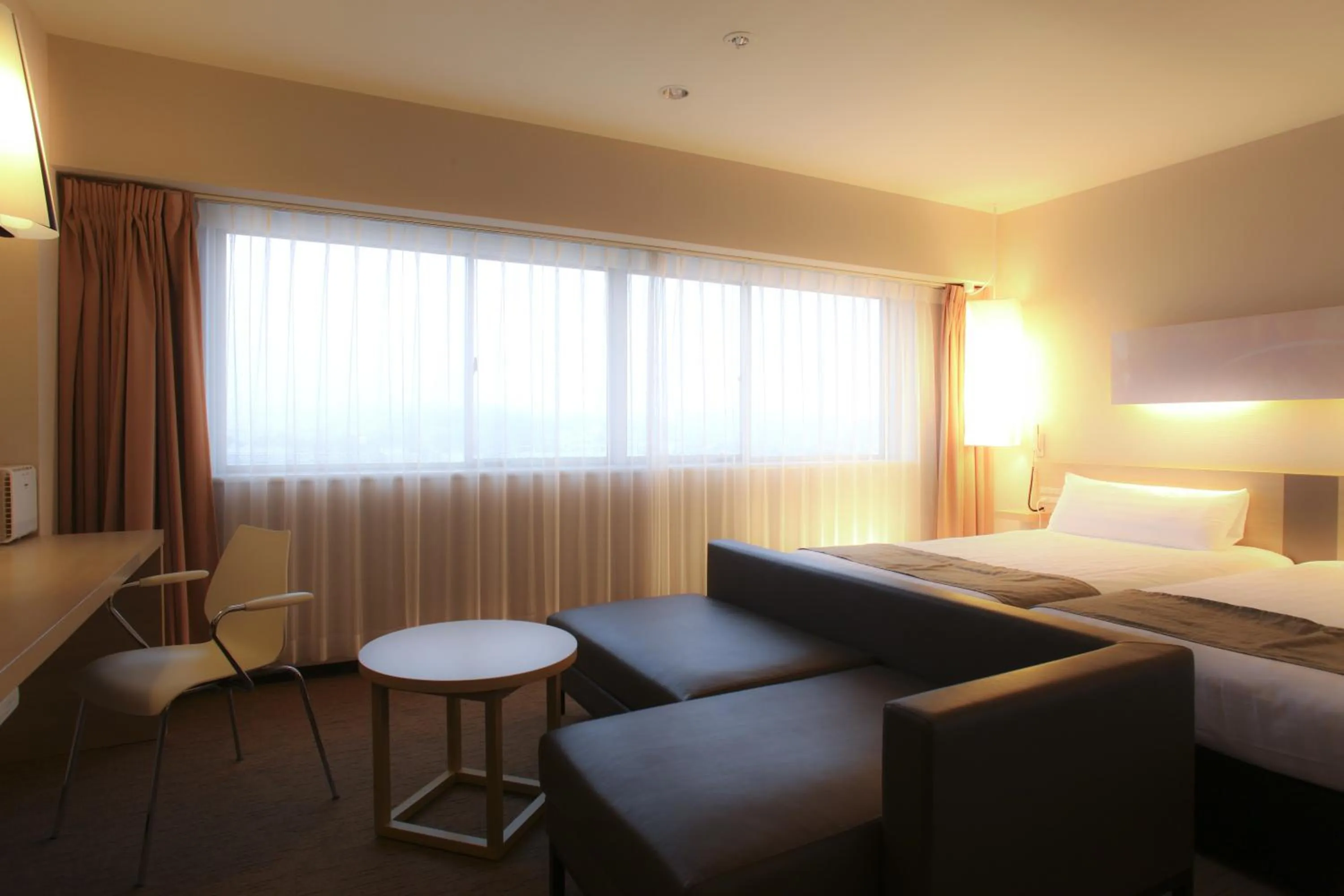 Seating area, Bed in KOKO HOTEL Numazu Inter