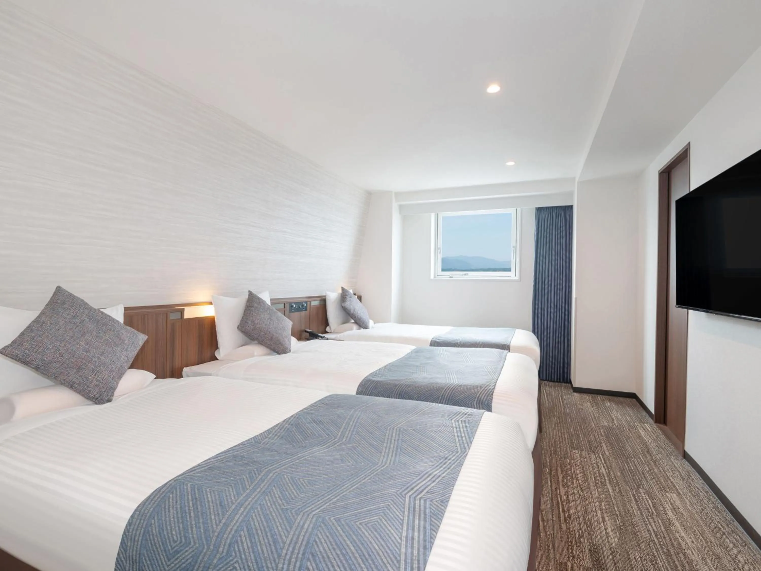 Photo of the whole room, Bed in ART HOTEL Miyazaki Sky Tower