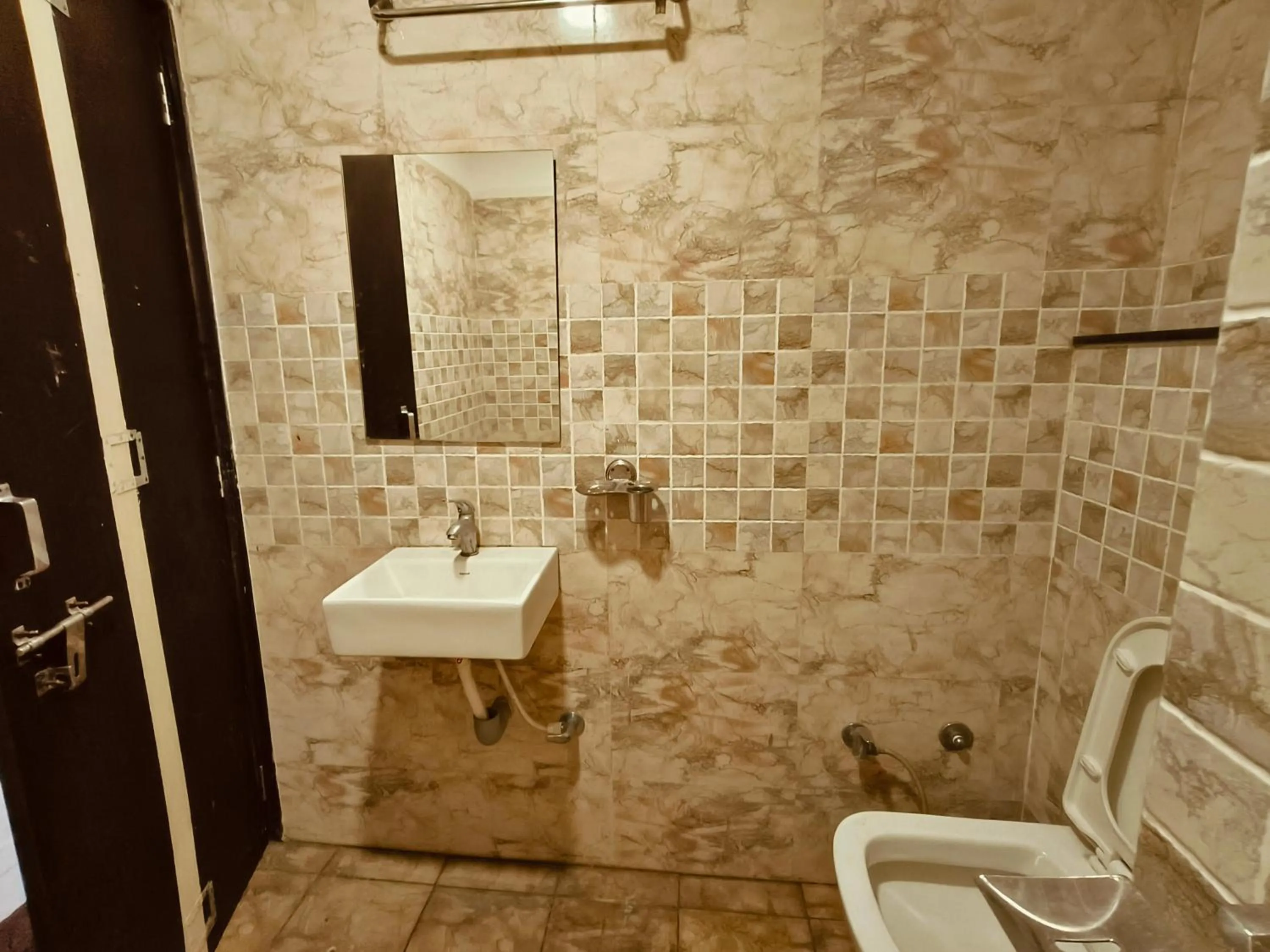 Bathroom in HOTEL MUSHAK by BAPPA PALACE