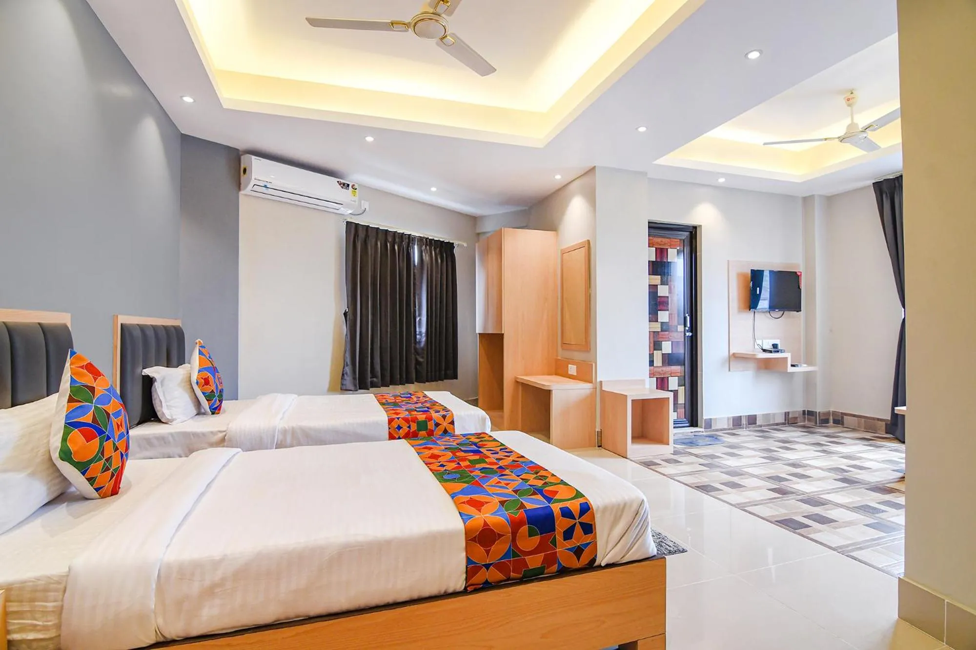 Bed in FabHotel JP - Nr Sataragachhi Railway Station