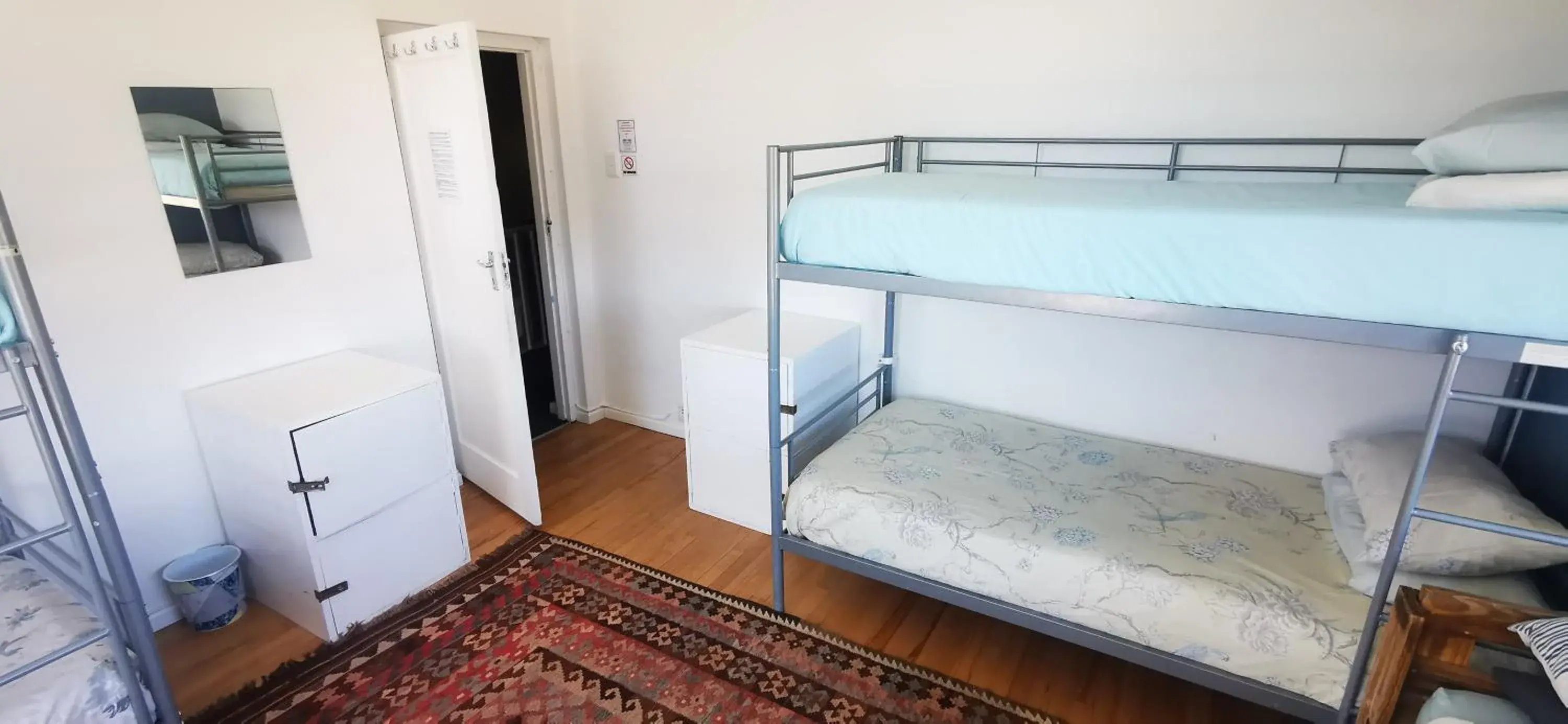 Dormitory Room – 7 beds (Mixed Gender) with Shared Communal Bathrooms - single occupancy in Hermanus Backpackers & Budget Accommodation Dormitory Room – 7 beds (Mixed Gender) with Shared Communal Bathrooms - single occupancy in Hermanus Backpackers & Budget Accommodation