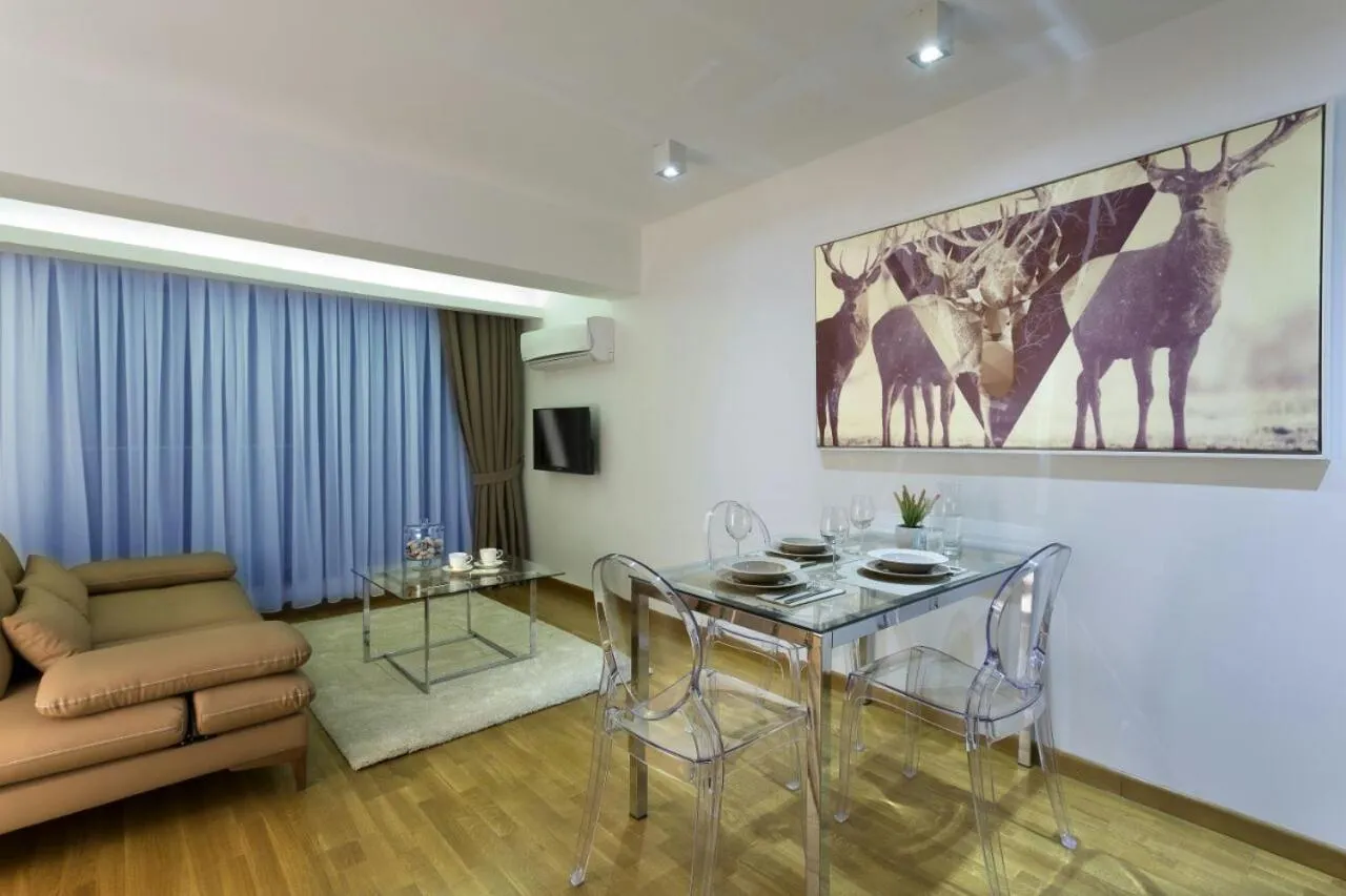 Living room in The Place Suit & Apartments