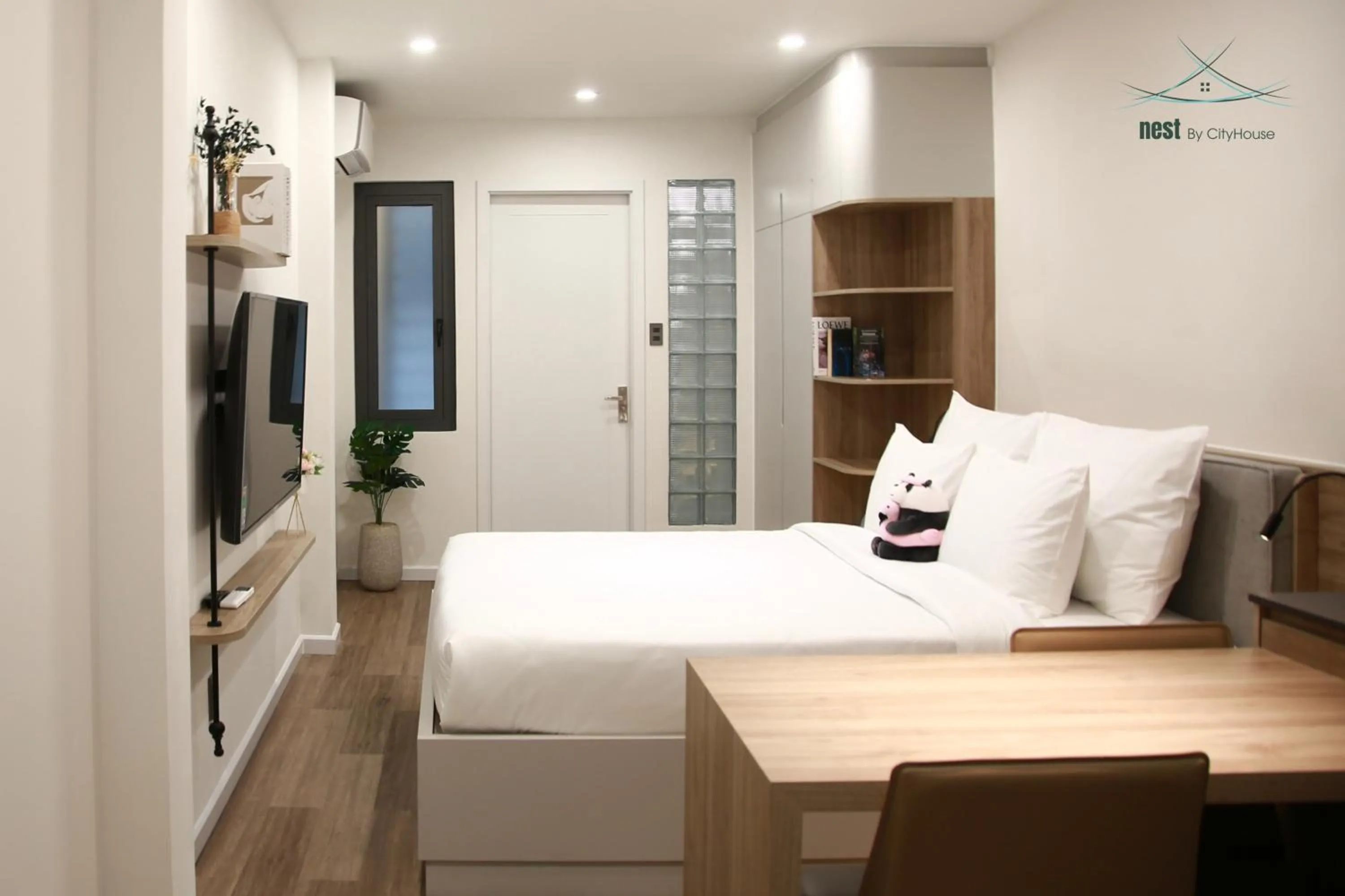 Communal lounge/ TV room, Bed in Cityhouse - Nest Minh Khai