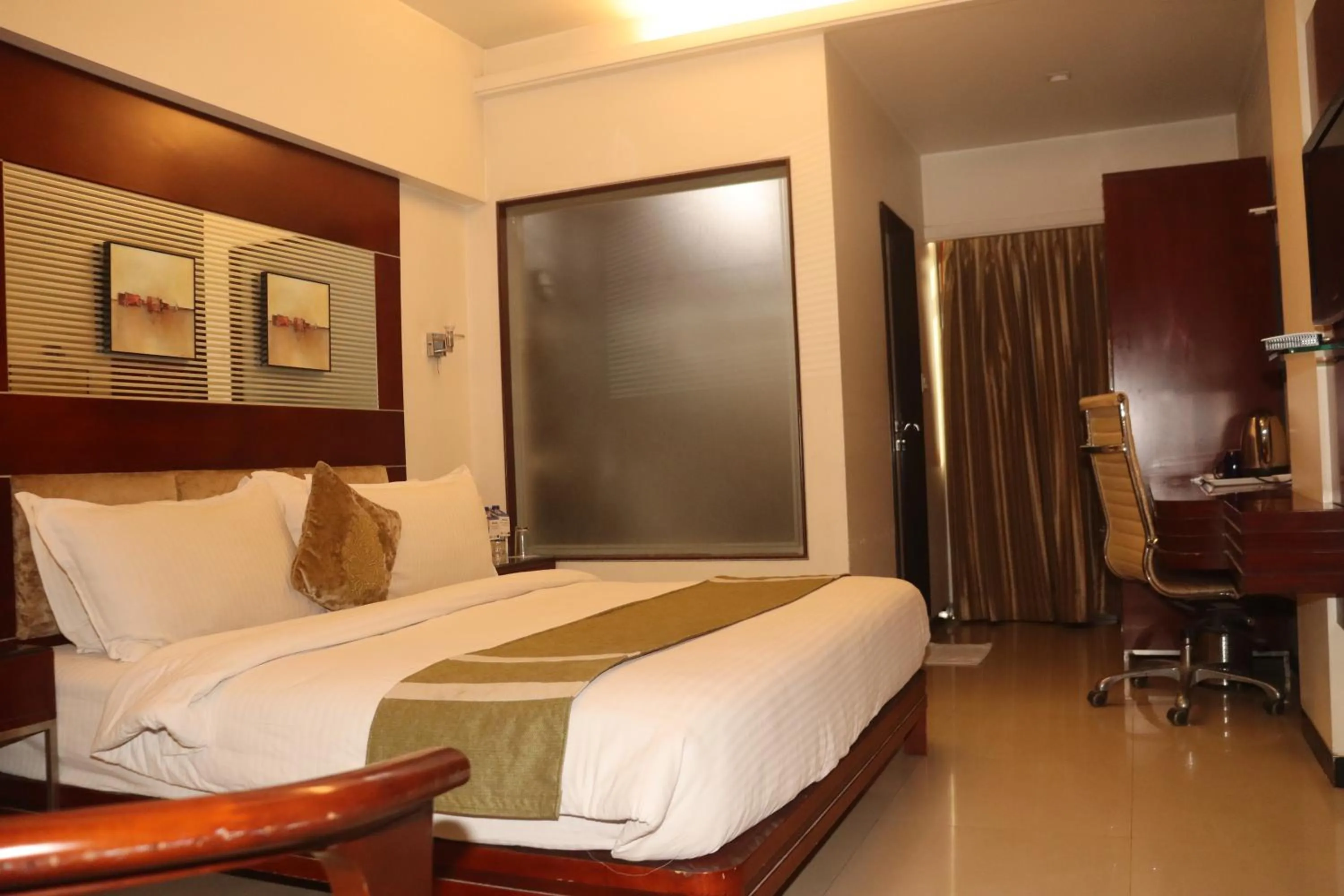 Bed in Kyriad Hotel Indore by OTHPL