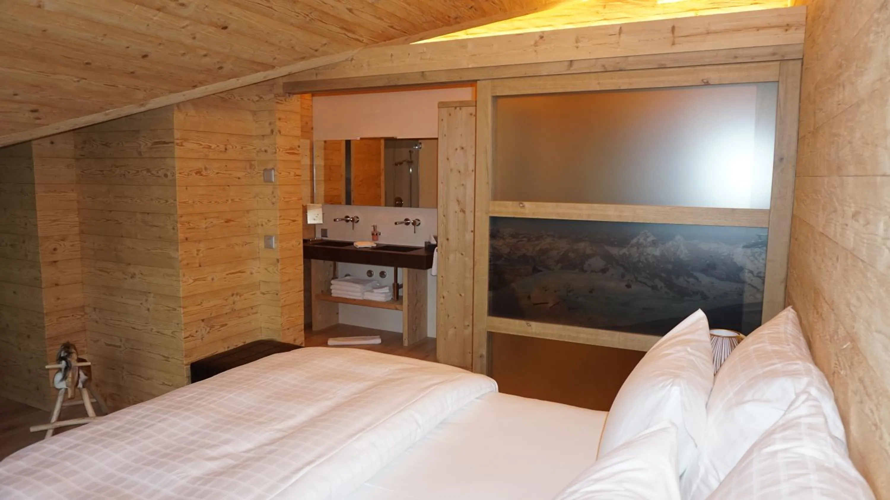 Photo of the whole room, Bed in Caschu Alp Boutique Design Hotel Stoos - adults only