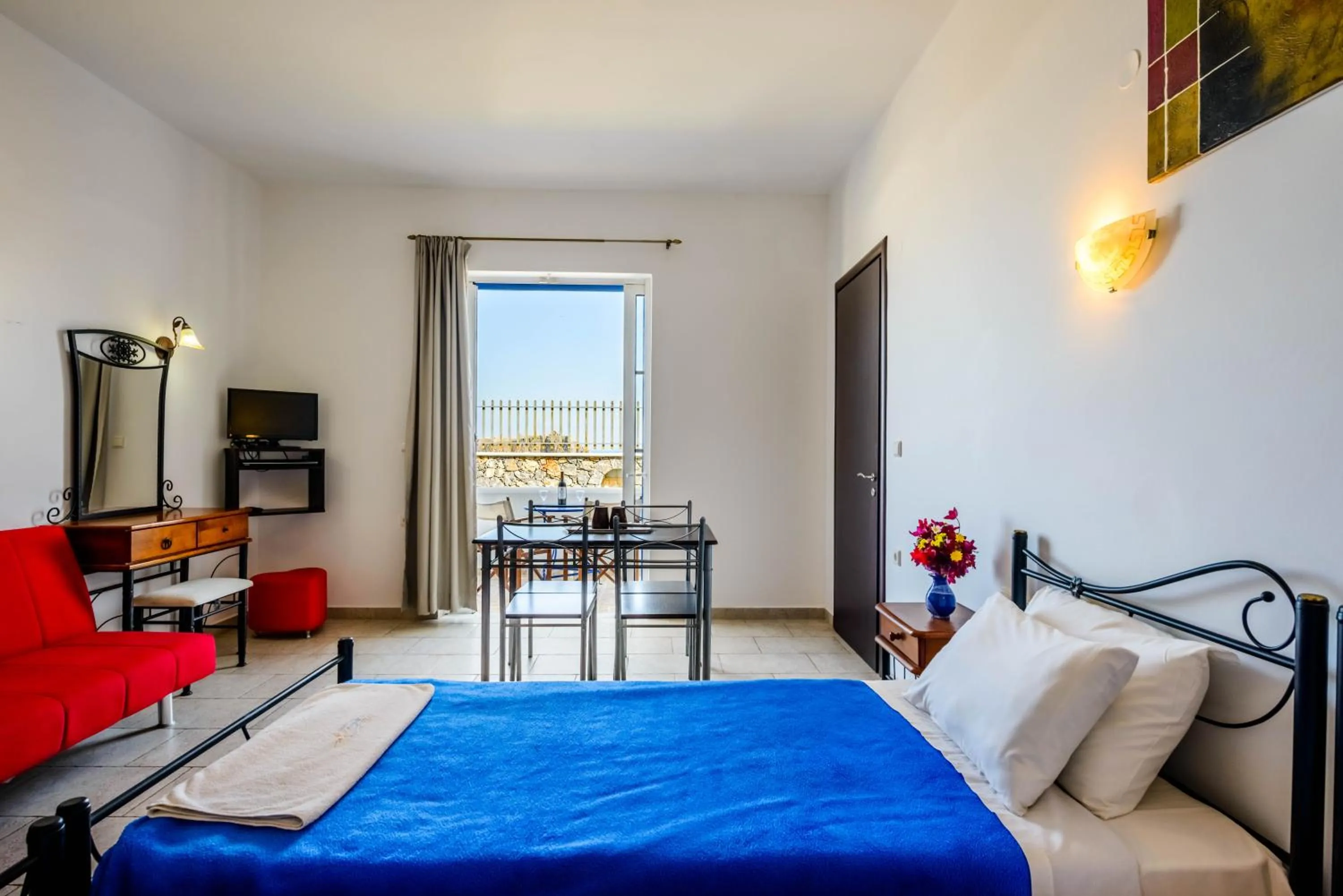 Bed in 'Lindian Myth' Sea View Studios