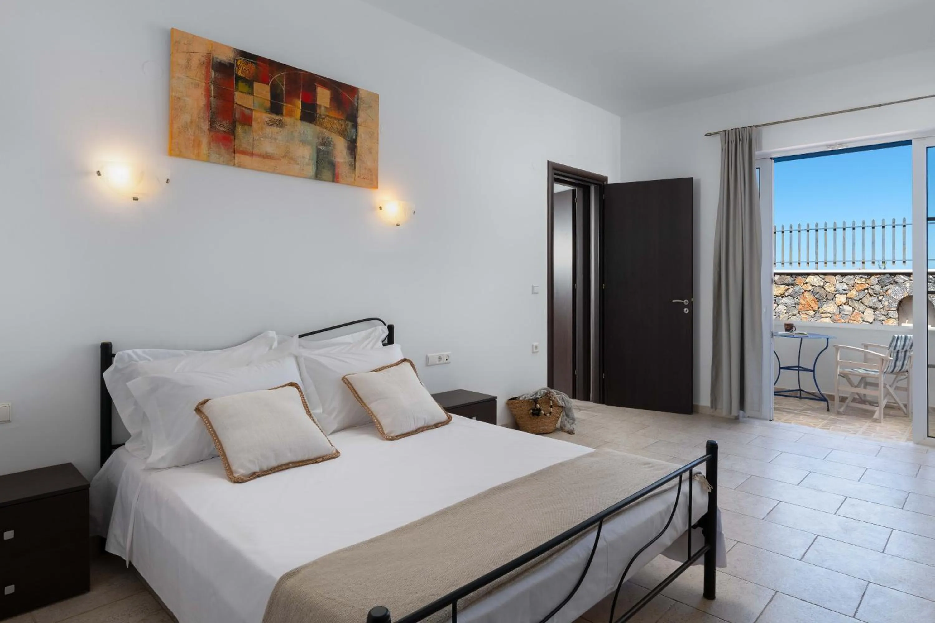 Bed in 'Lindian Myth' Sea View Studios