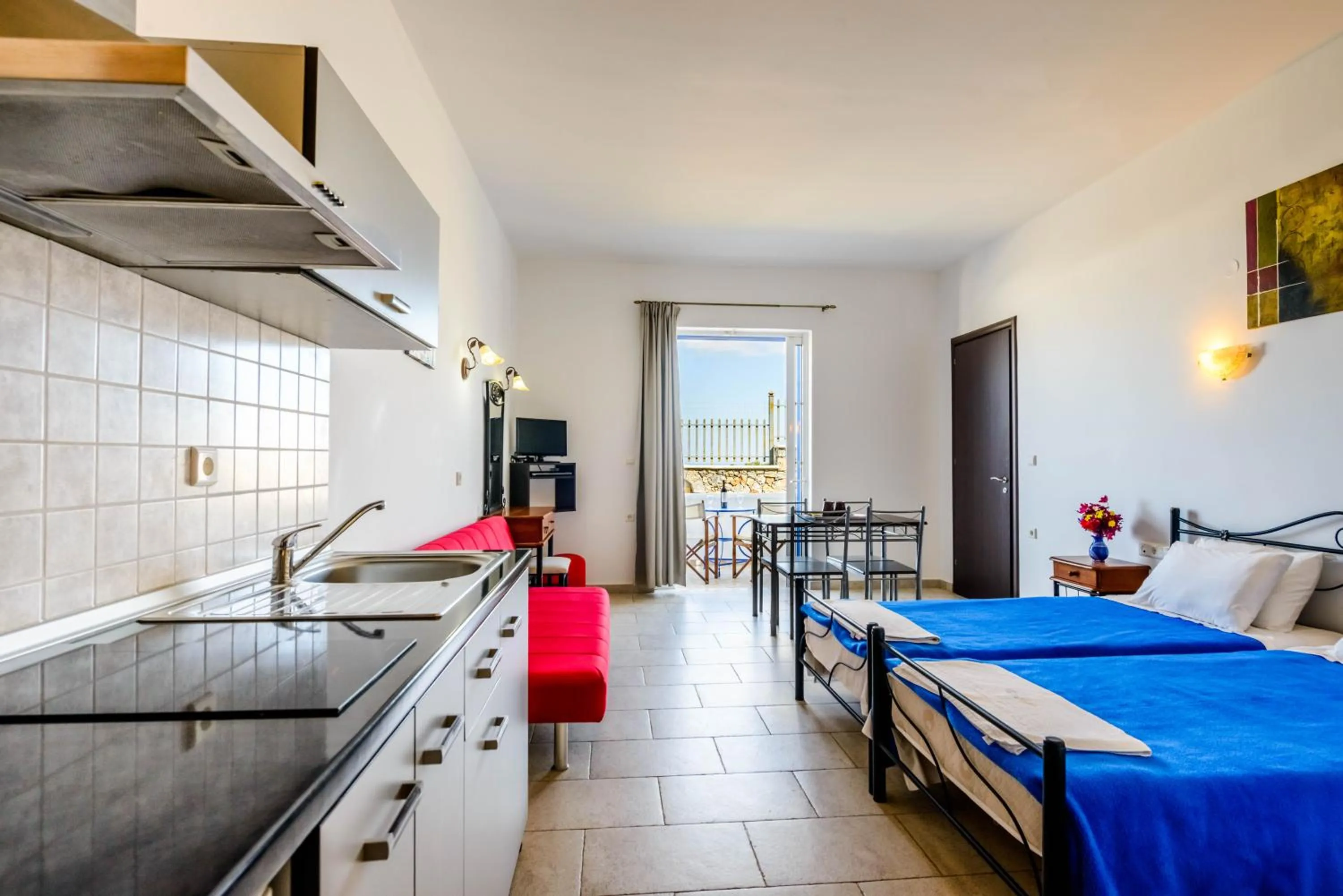 Bed in 'Lindian Myth' Sea View Studios