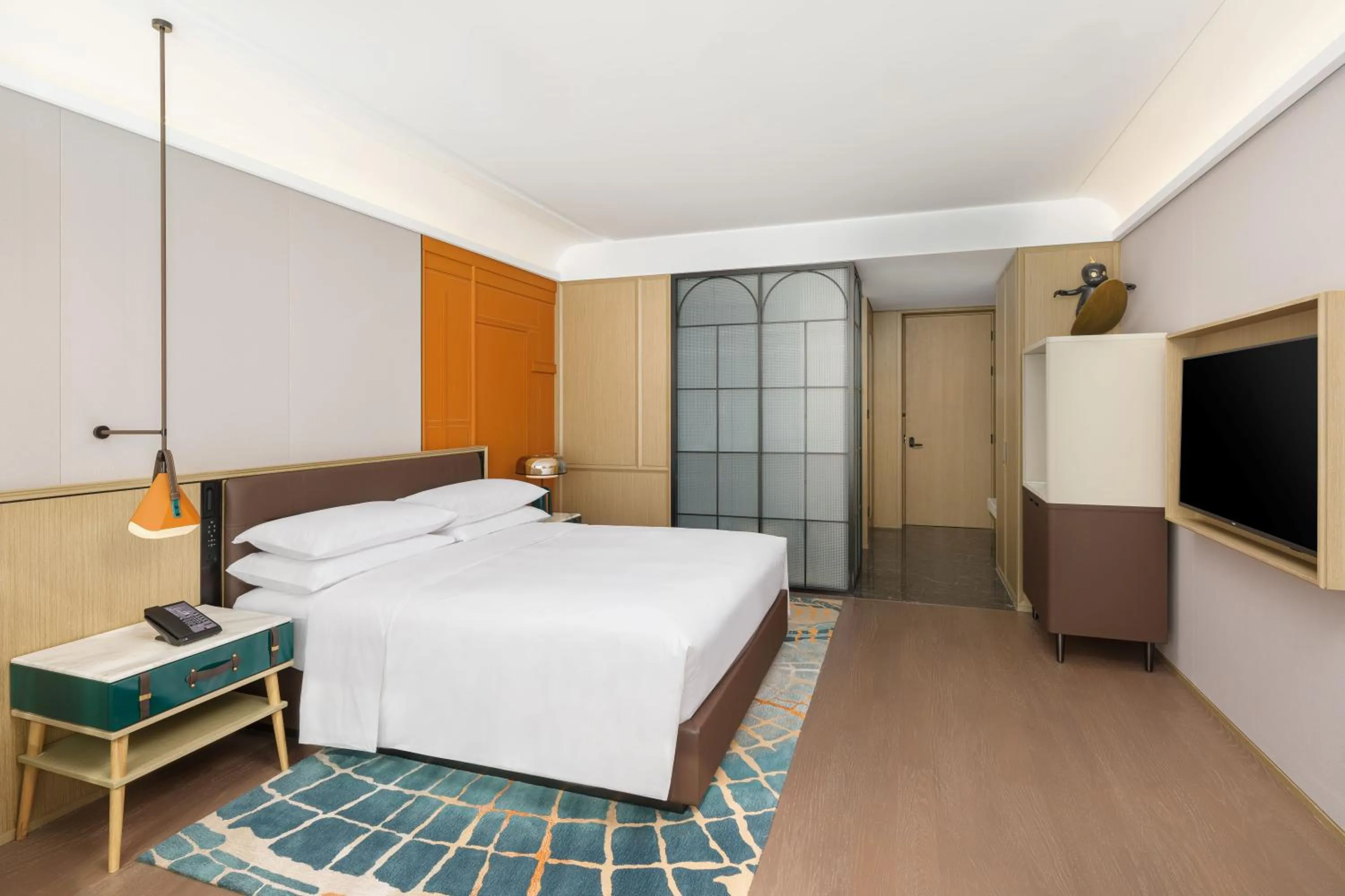 Bed in Renaissance Qingdao Hotel