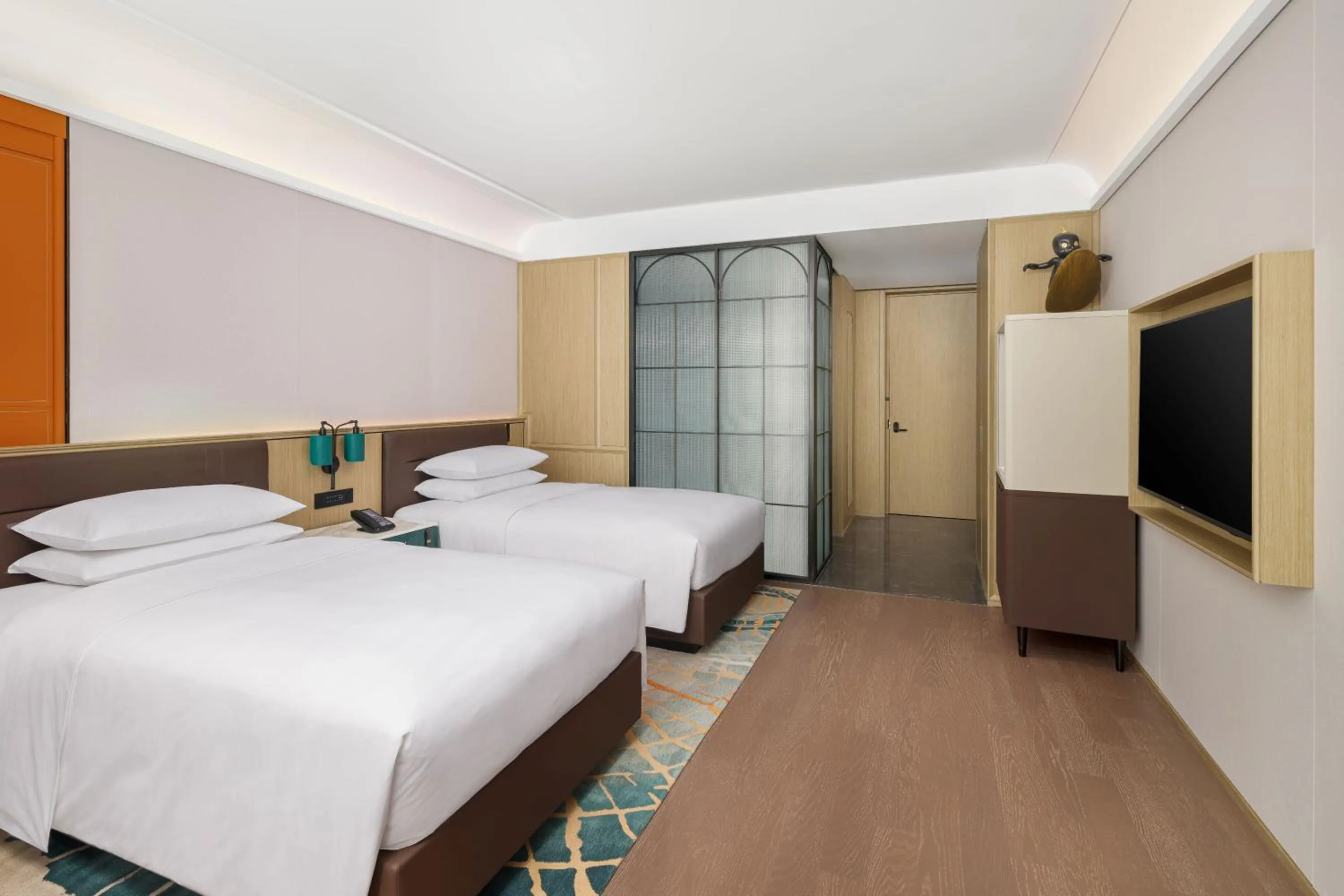 Bed in Renaissance Qingdao Hotel