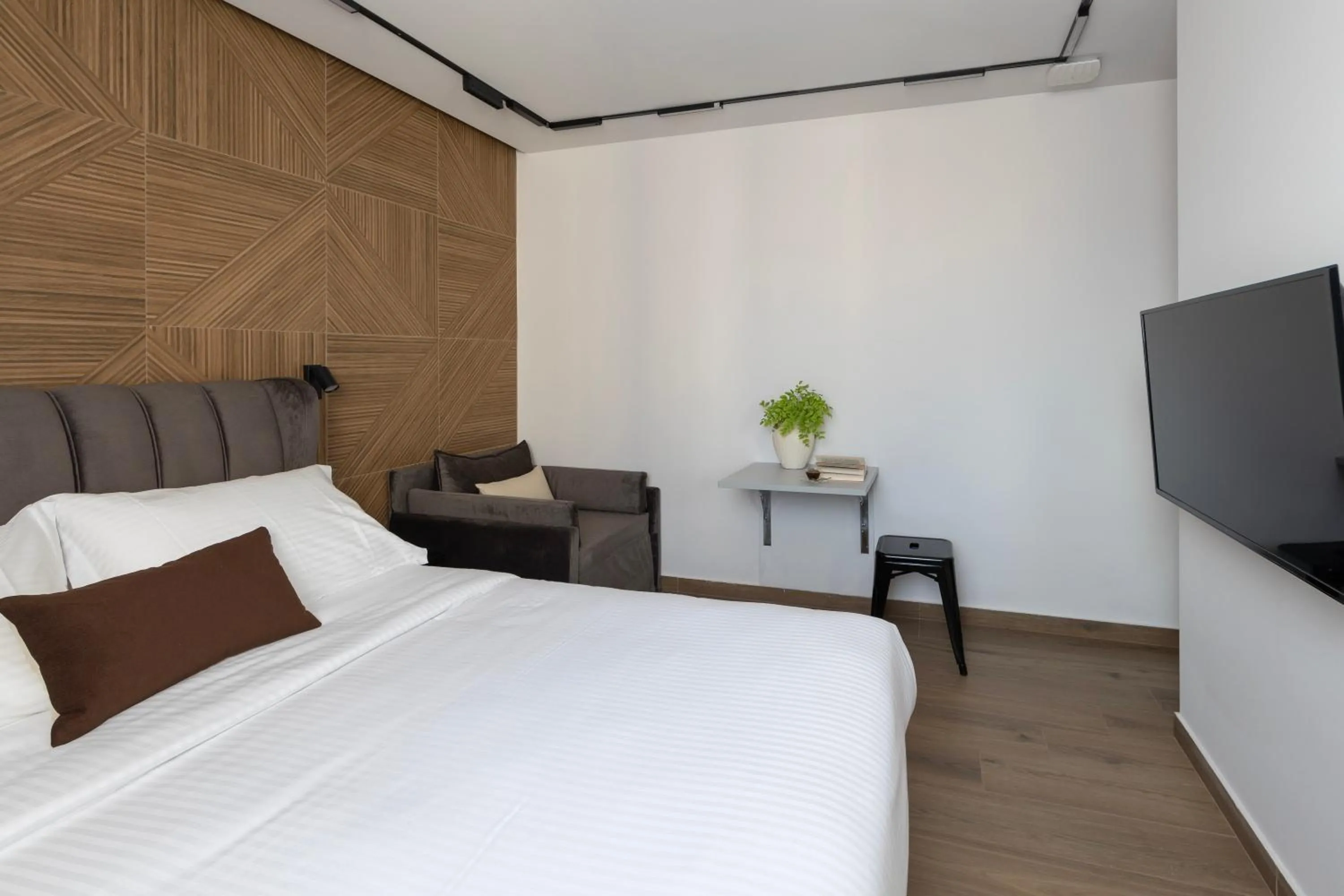 Bed in DOMIOS Suites Athens