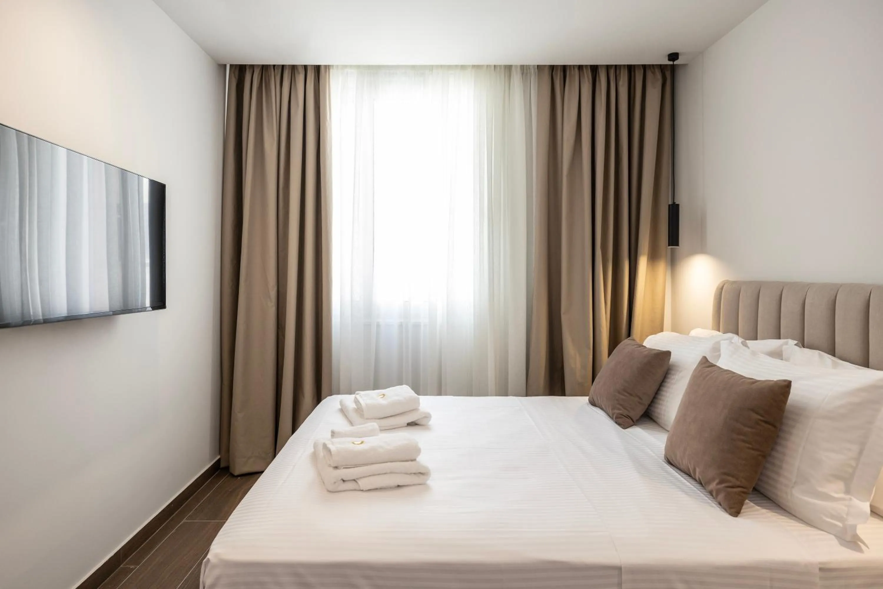 Bed in DOMIOS Suites Athens