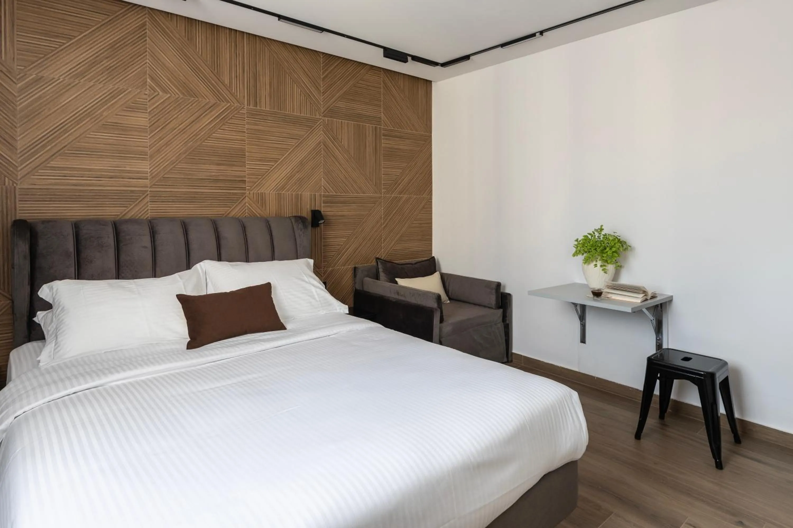 Bed in DOMIOS Suites Athens