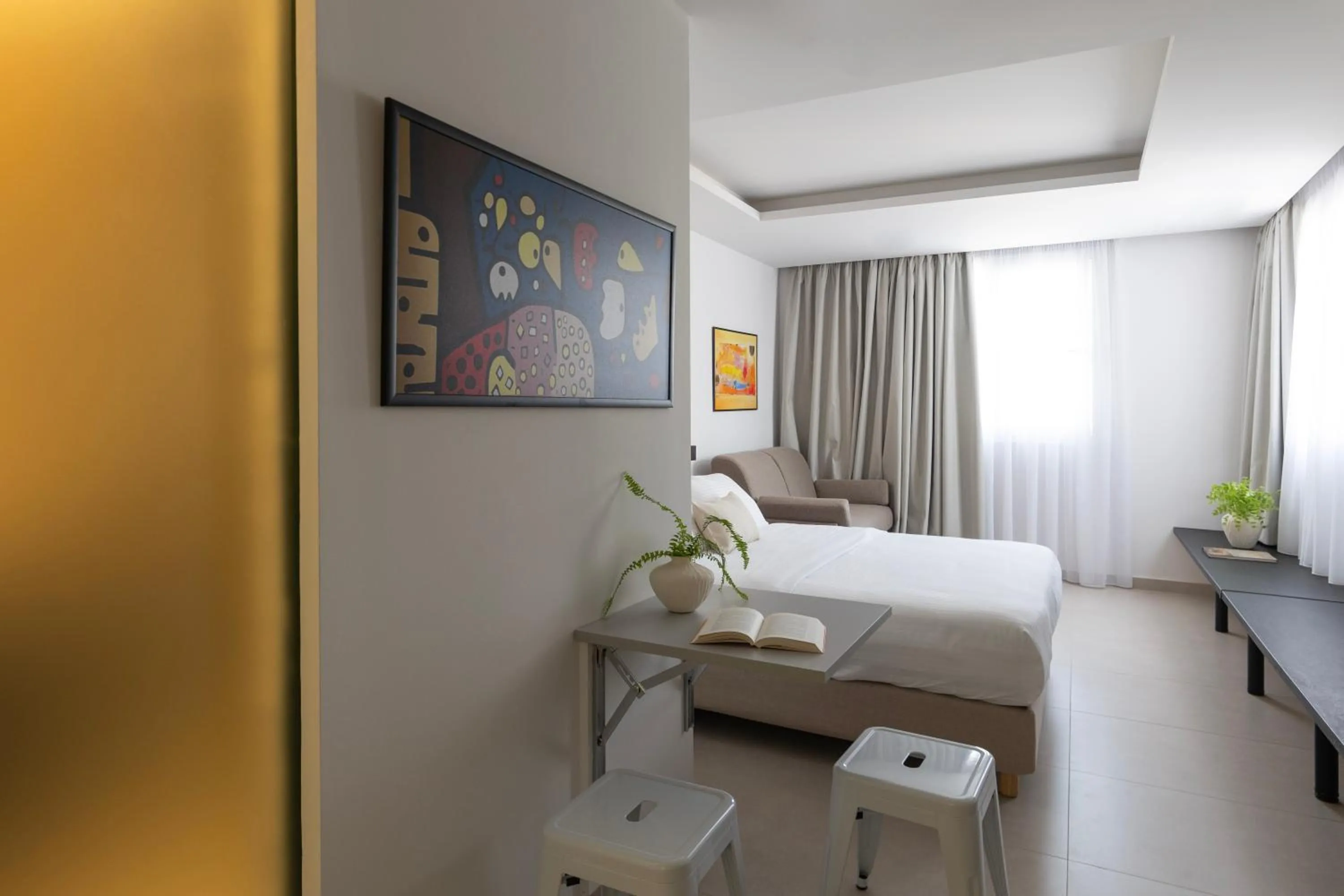 Bed in DOMIOS Suites Athens