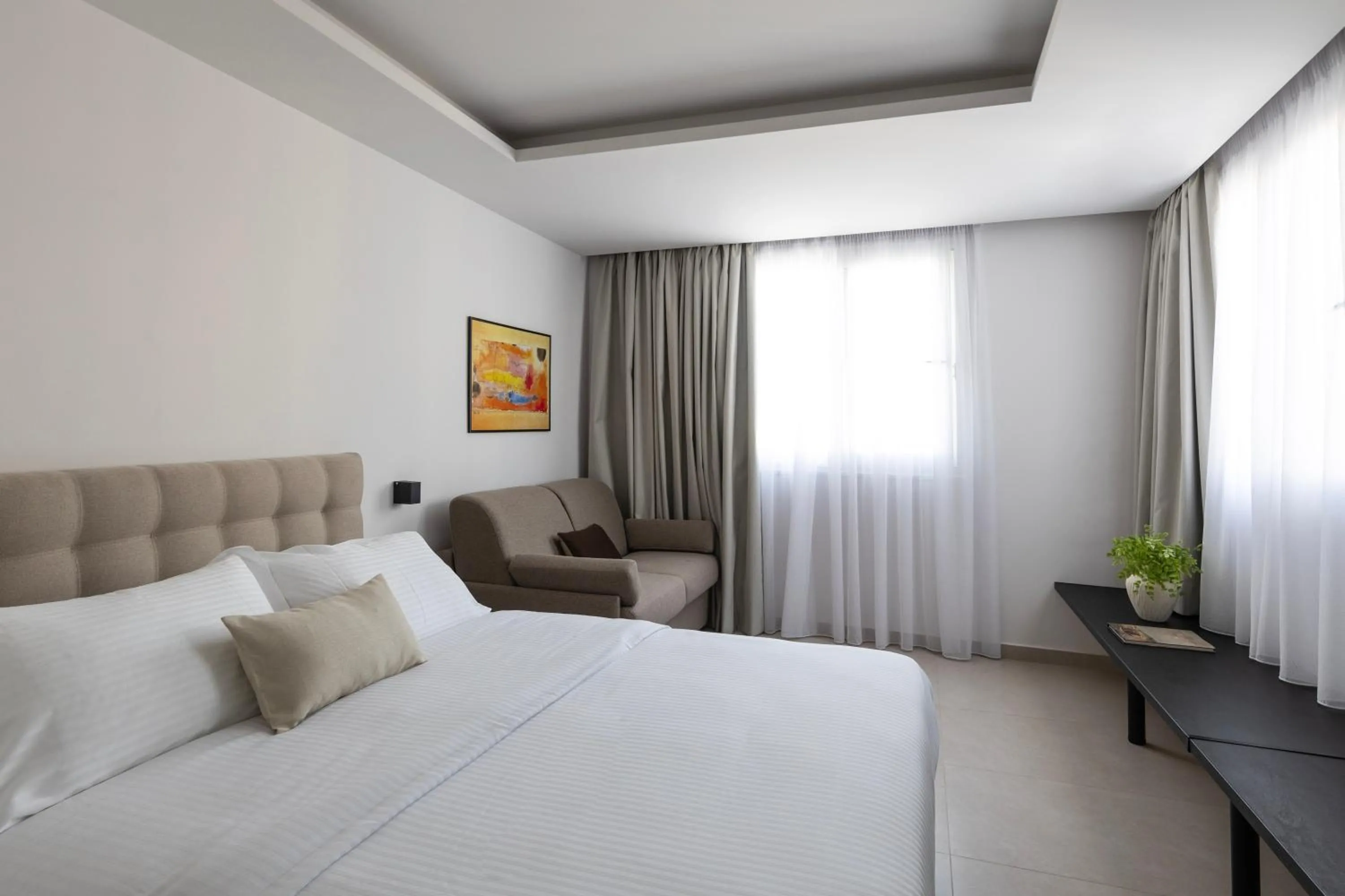 Bed in DOMIOS Suites Athens
