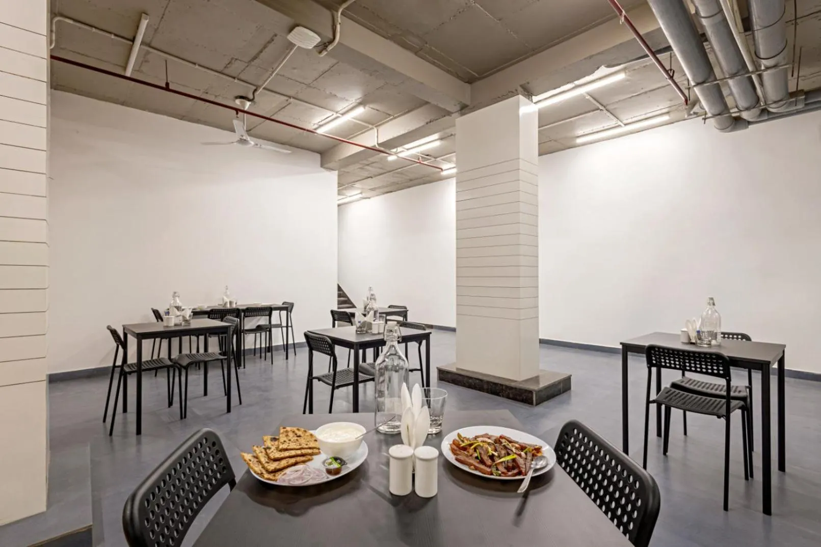 Dining area in Wandr Hotel Medicity Gurugram, Near Medanta Hospital