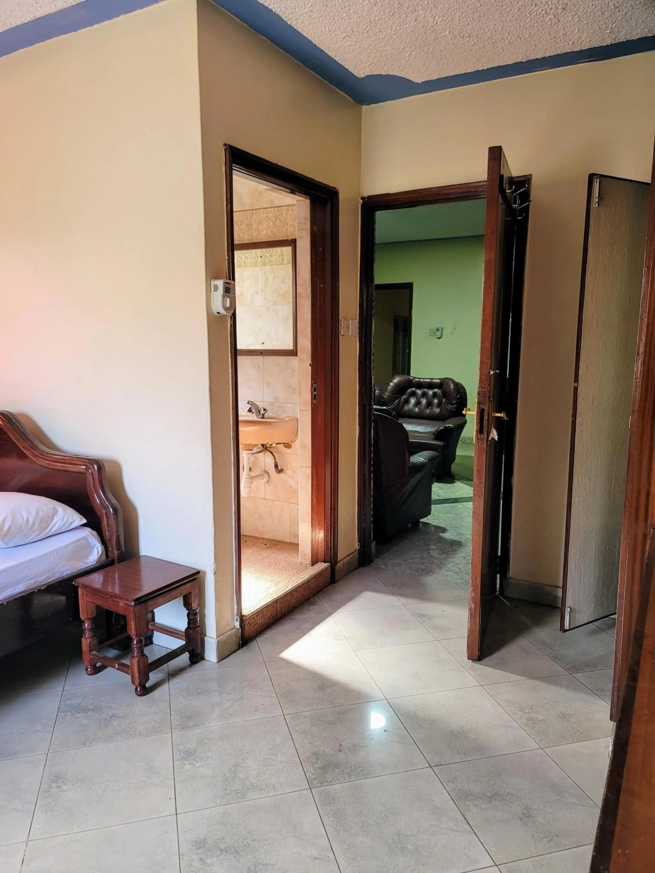 Living room, Bed in Nairobi Glory Palace Hotel