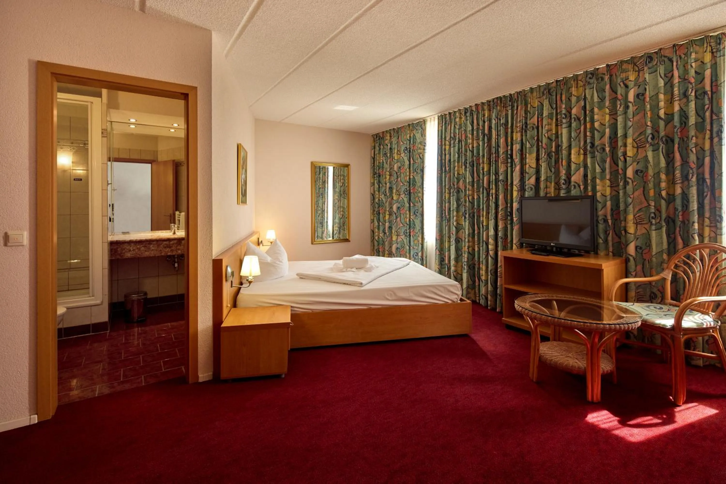 Bed in TRIP INN Axxon Hotel