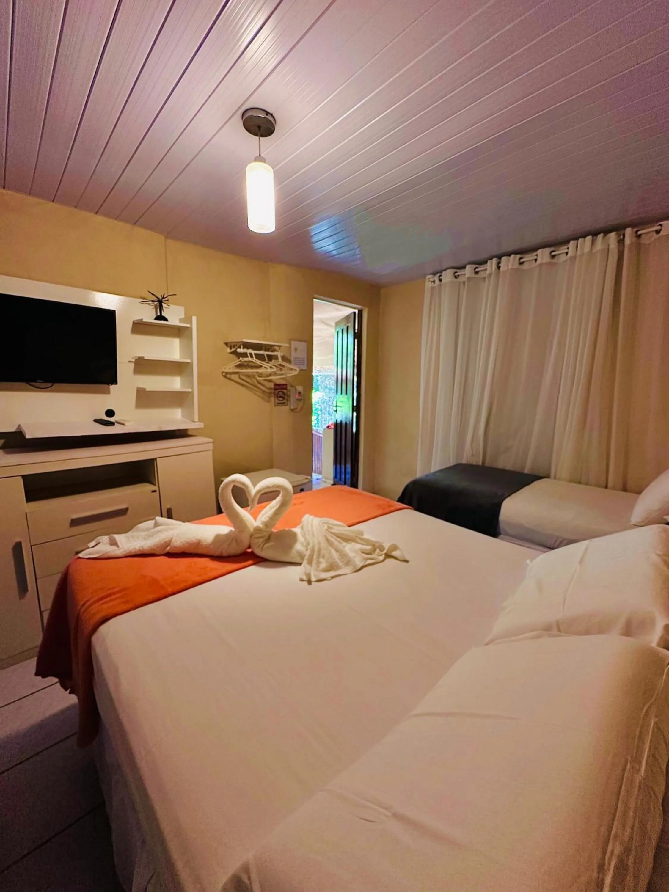Photo of the whole room, Bed in Pousada do Golfinho Fernando de Noronha