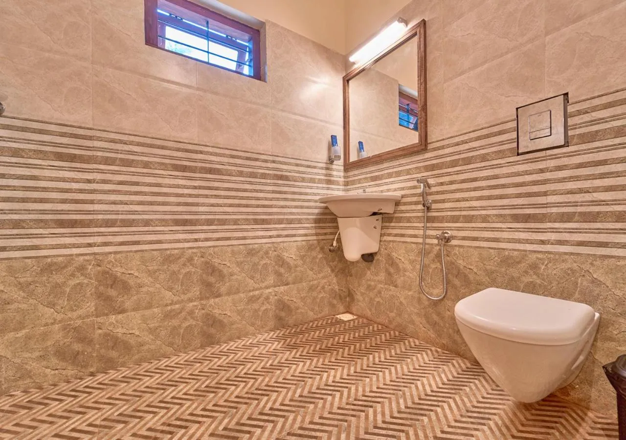 Shower in Ushasree Wayanad Premium Pool Resort by VOYE HOMES