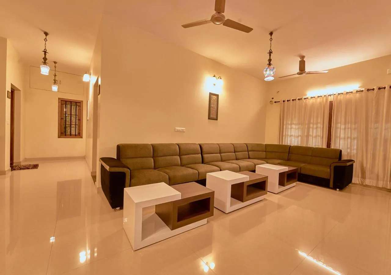 Living room in Ushasree Wayanad Premium Pool Resort by VOYE HOMES