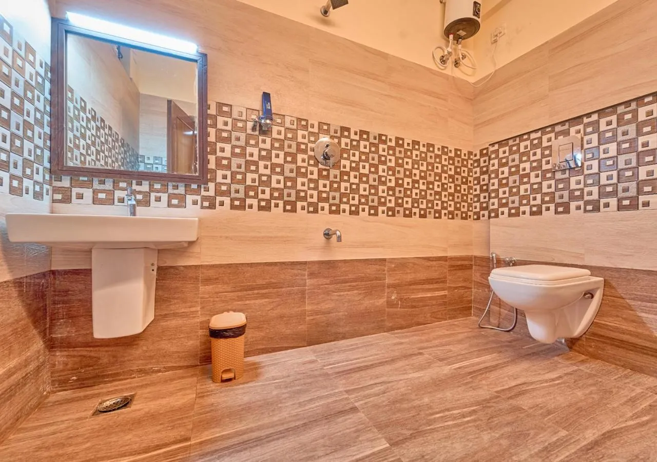 Shower in Ushasree Wayanad Premium Pool Resort by VOYE HOMES