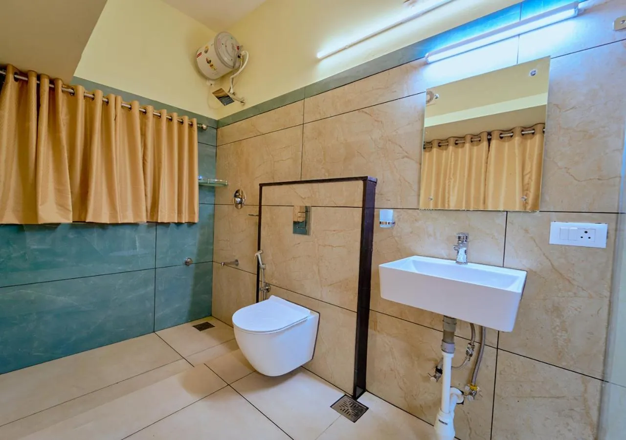 Bathroom in Ushasree Wayanad Premium Pool Resort by VOYE HOMES