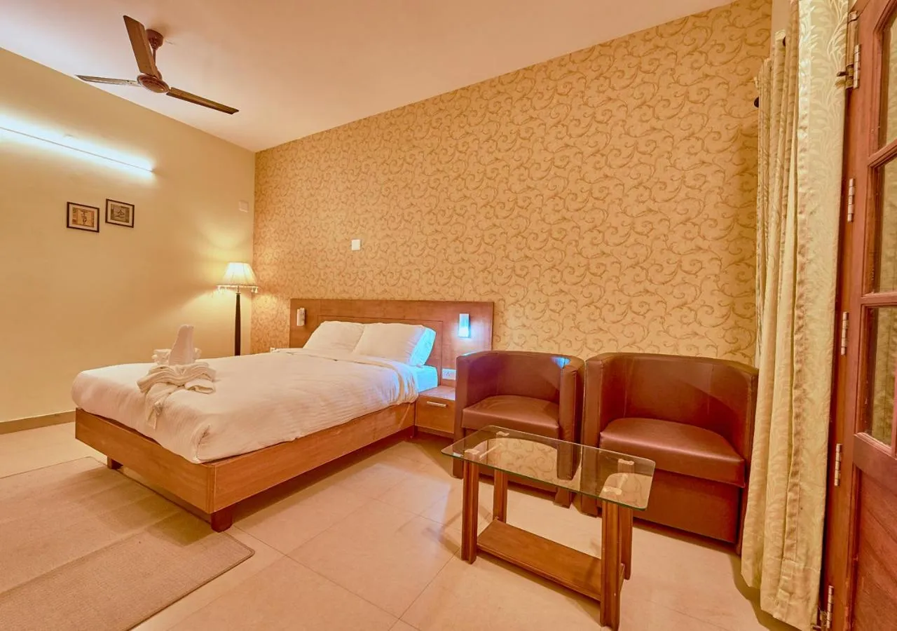Bed in Ushasree Wayanad Premium Pool Resort by VOYE HOMES