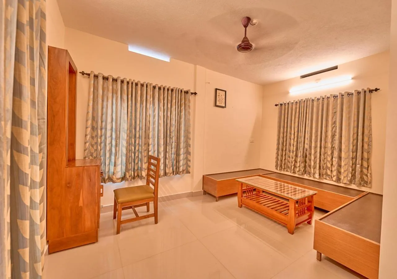 Living room, Bed in Ushasree Wayanad Premium Pool Resort by VOYE HOMES