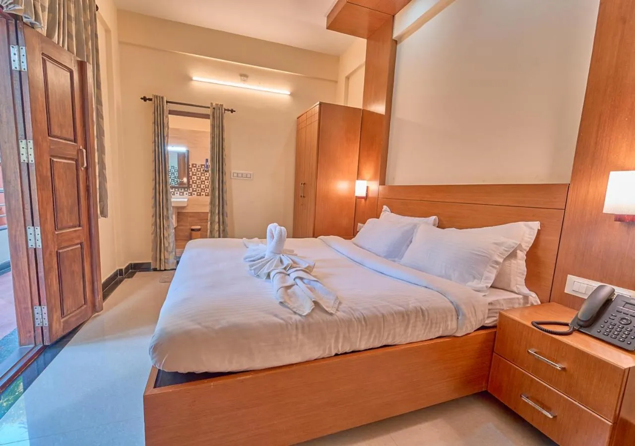 Bed in Ushasree Wayanad Premium Pool Resort by VOYE HOMES