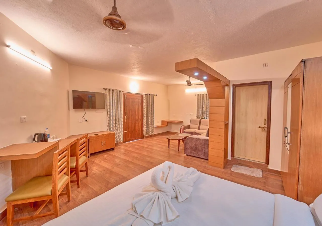 Communal lounge/ TV room, Bed in Ushasree Wayanad Premium Pool Resort by VOYE HOMES